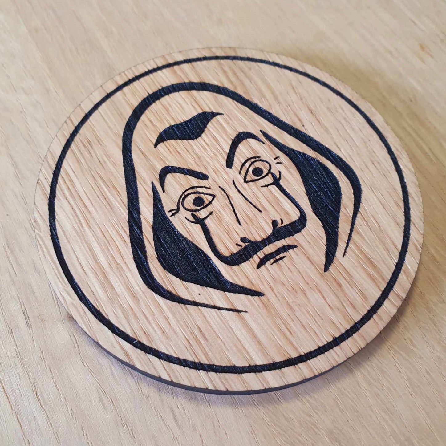 Laser cut wooden coaster personalised. Dali Mask Heist