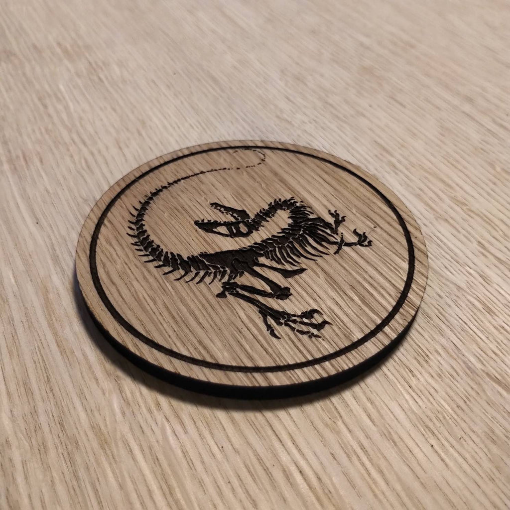 Laser cut wooden coaster personalised. Raptor Dinosaur Skeleton Fossil