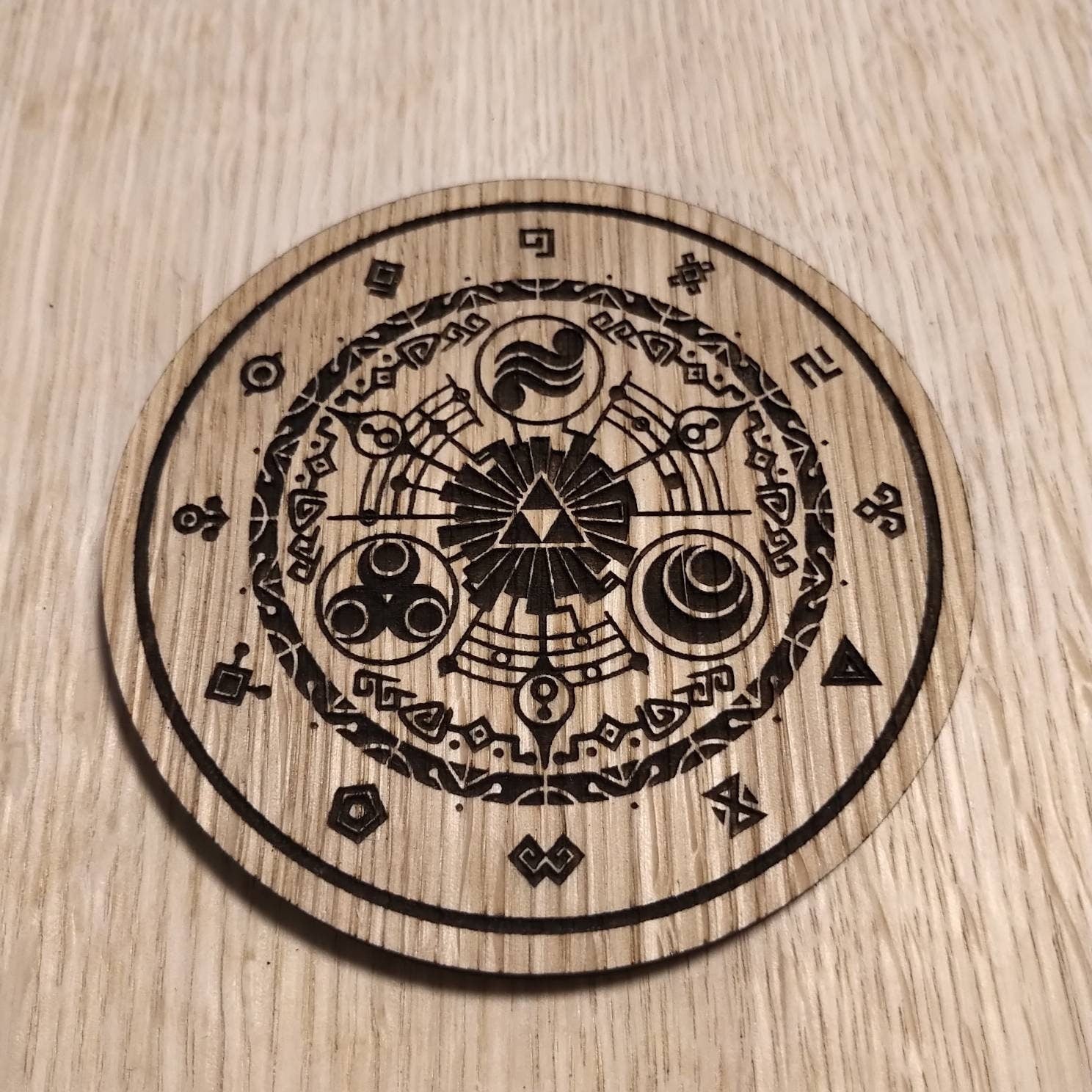 Laser cut wooden coaster personalised. Legend Link Circular Design
