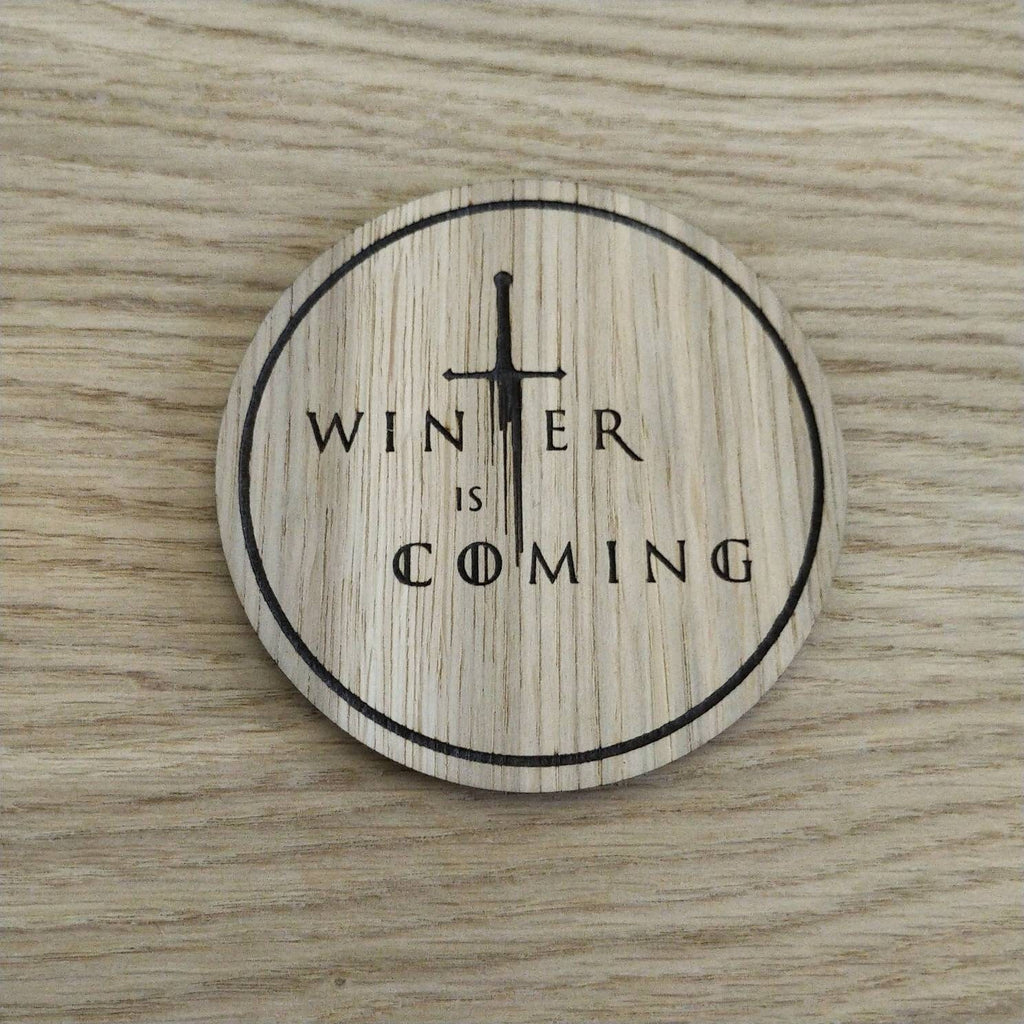 Laser cut wooden coaster. winter sword quote