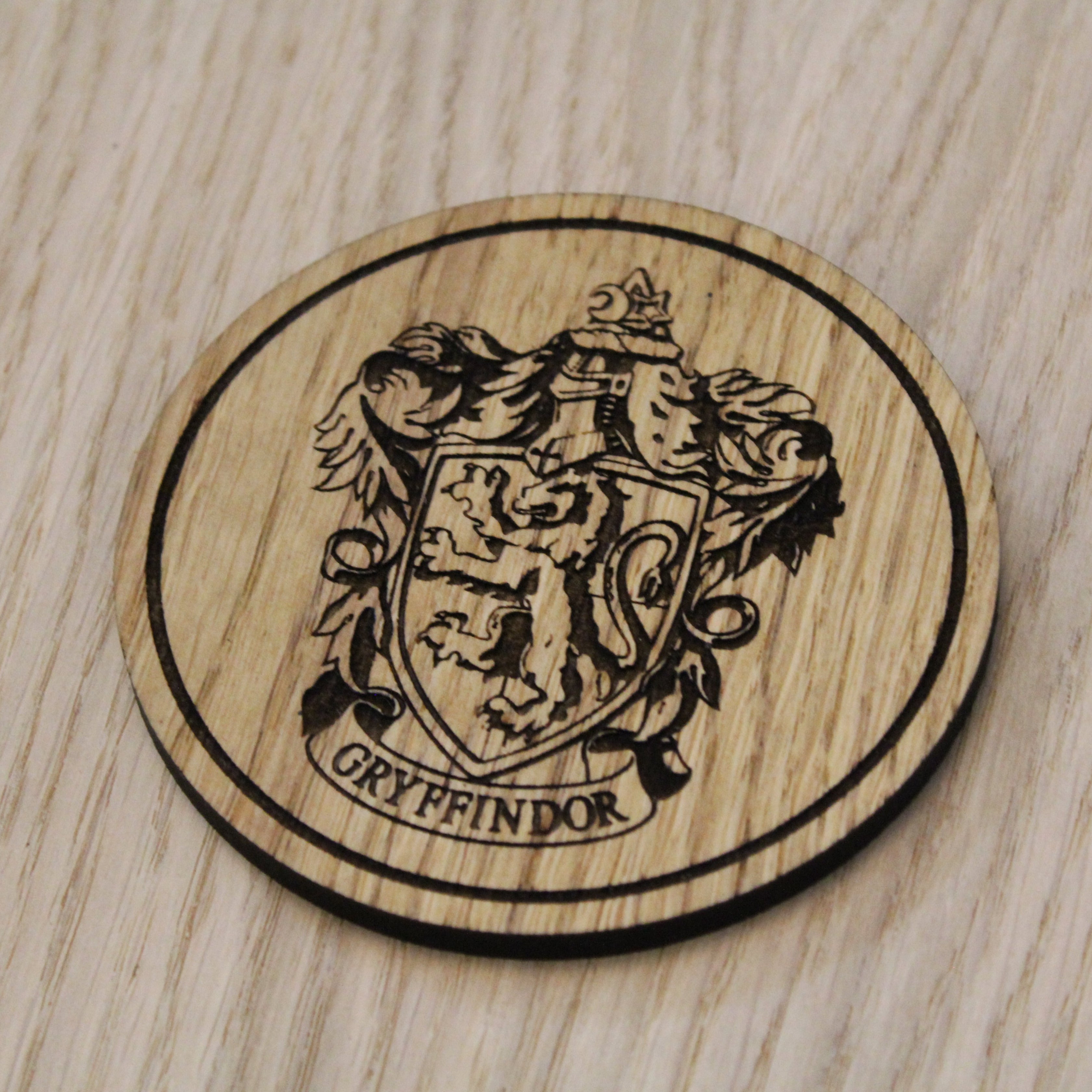 Laser cut wooden coaster. gryff indor