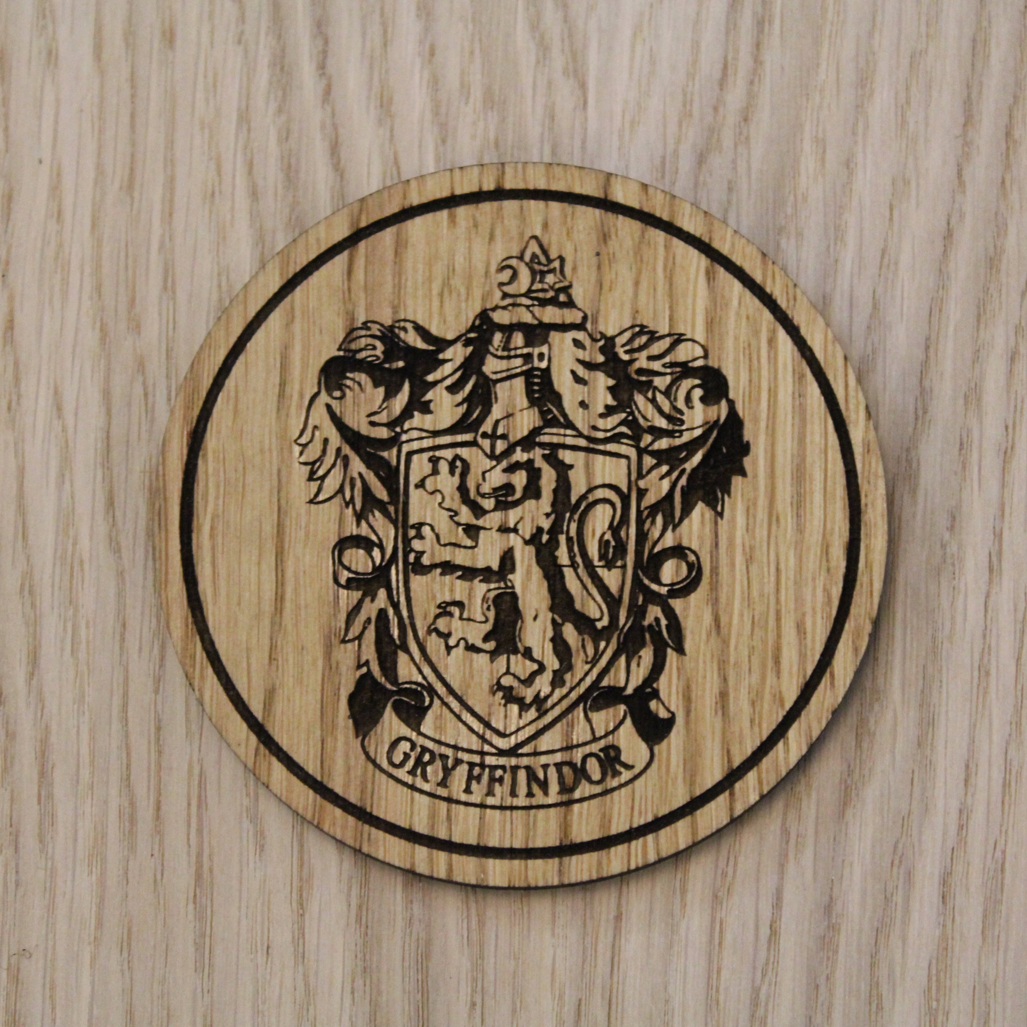 Laser cut wooden coaster. gryff indor