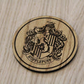 Laser cut wooden coaster. Huffle puff
