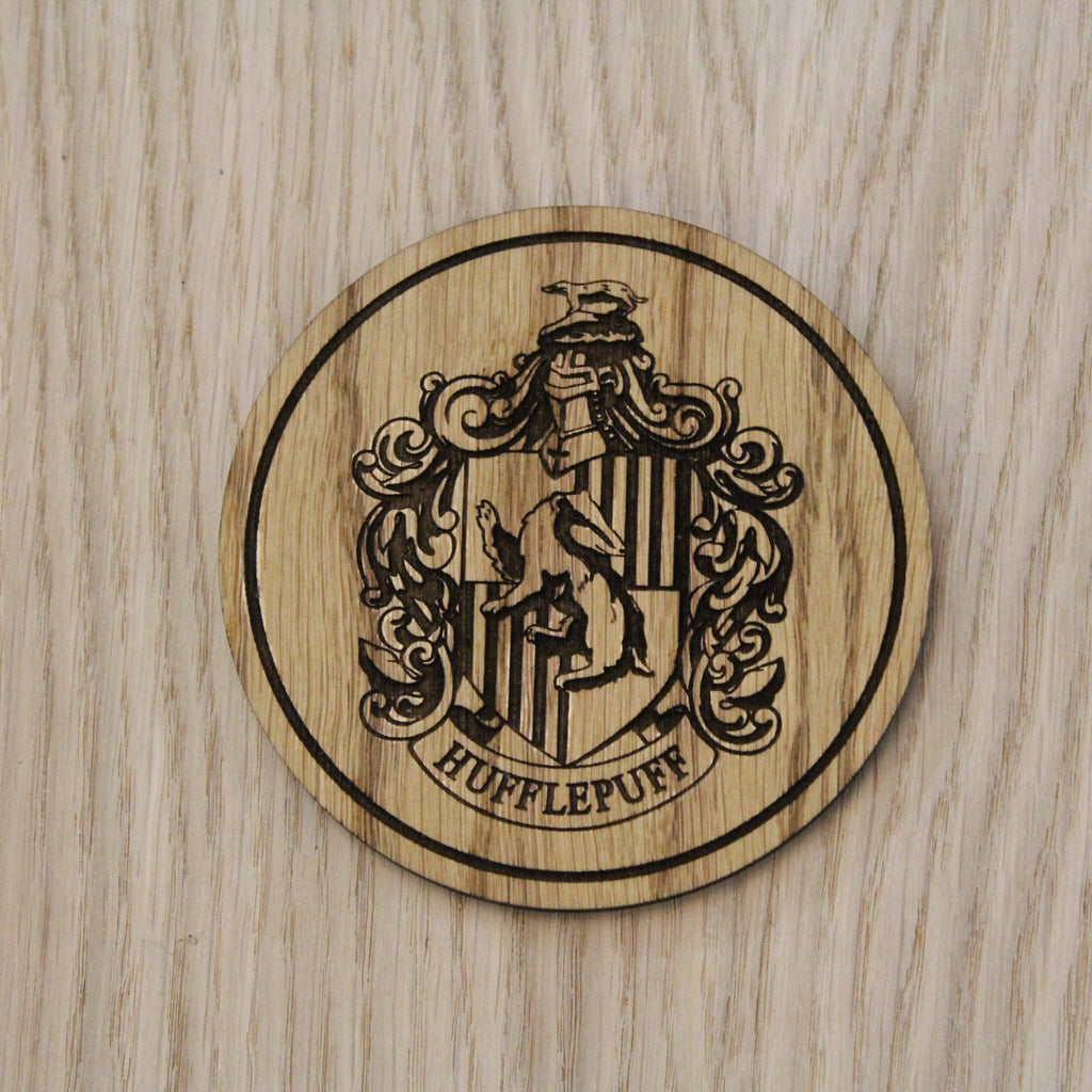 Laser cut wooden coaster. Huffle puff