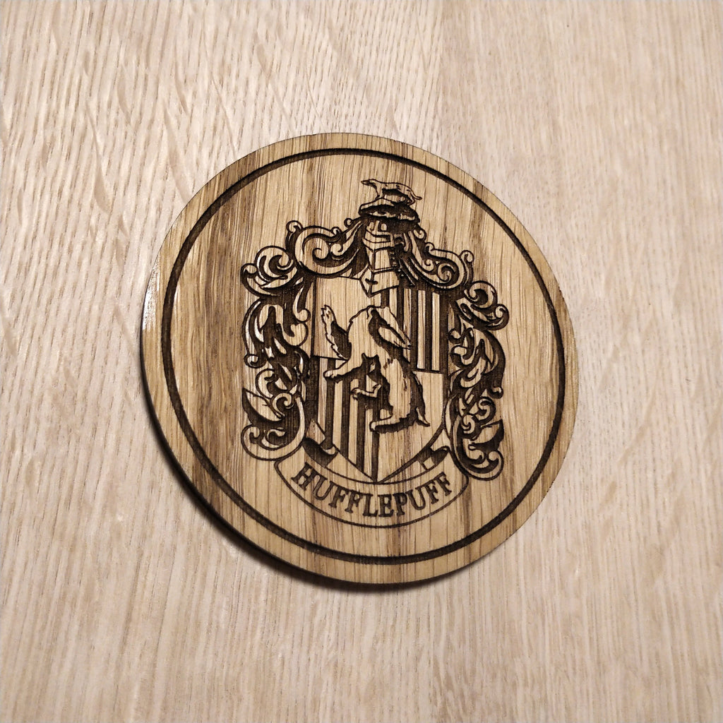 Laser cut wooden coaster. Huffle puff