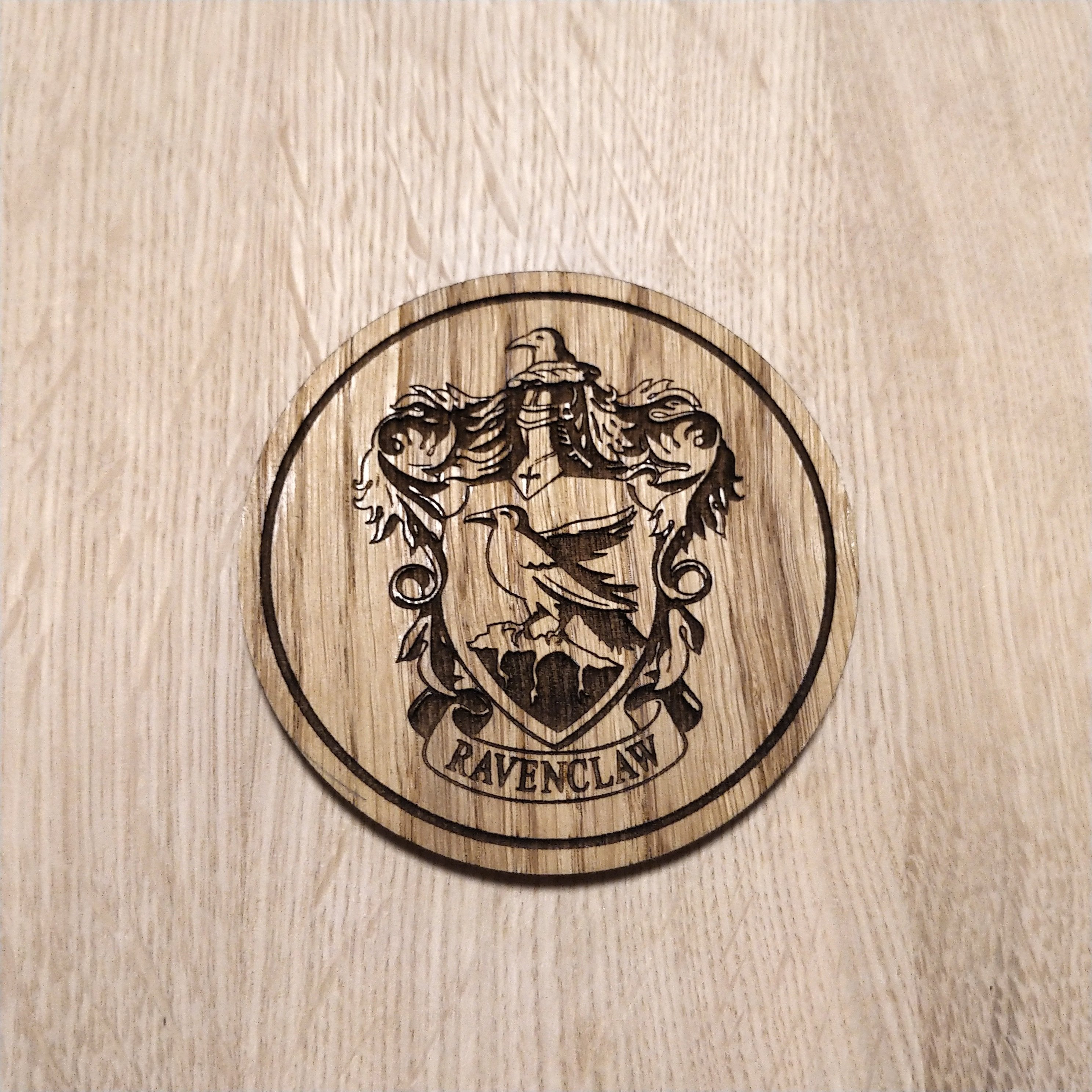 Laser cut wooden coaster. Raven claw