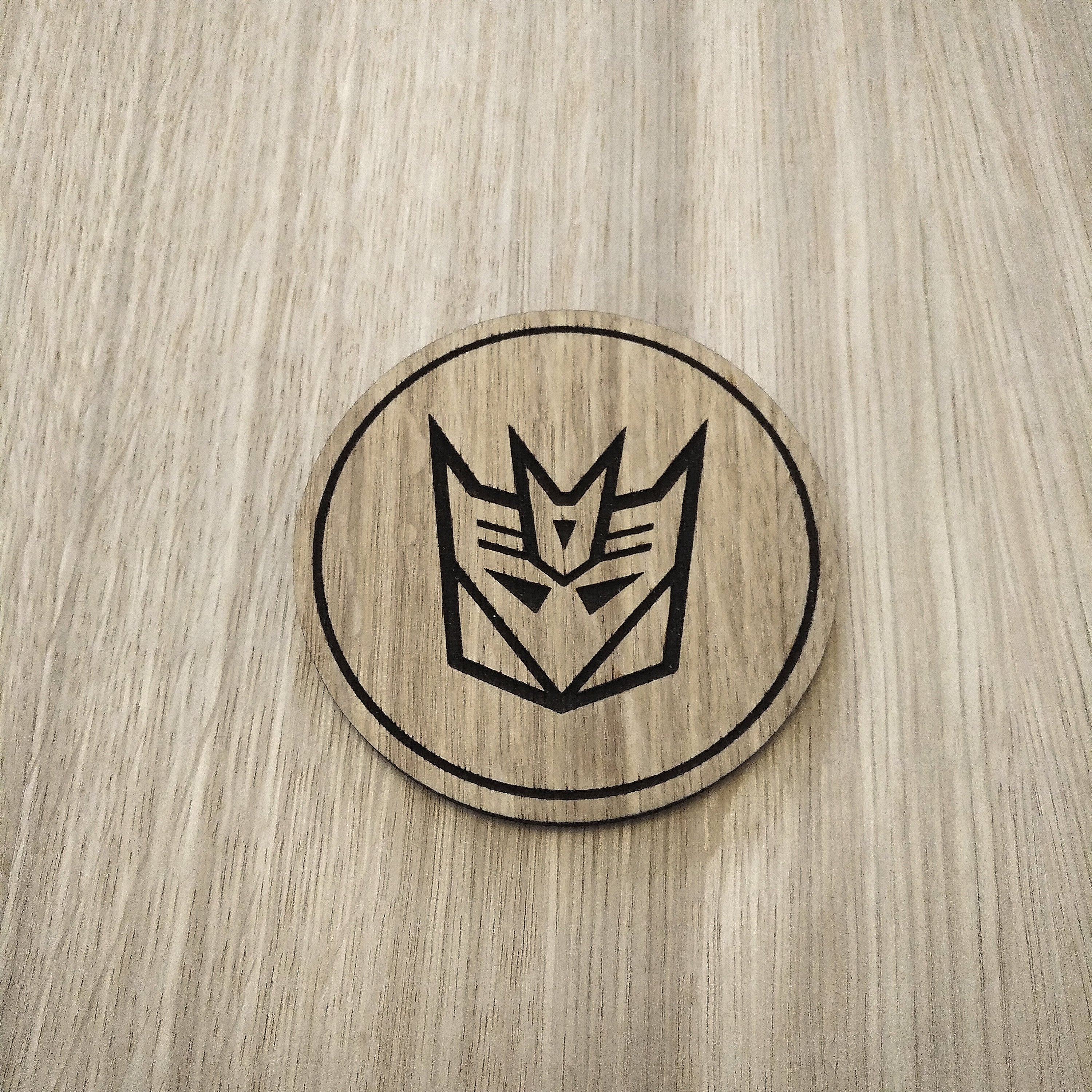 Laser cut wooden coaster. Deception 1980s cartoon
