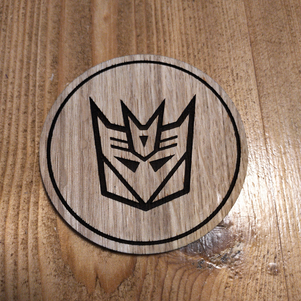 Laser cut wooden coaster. Deception 1980s cartoon