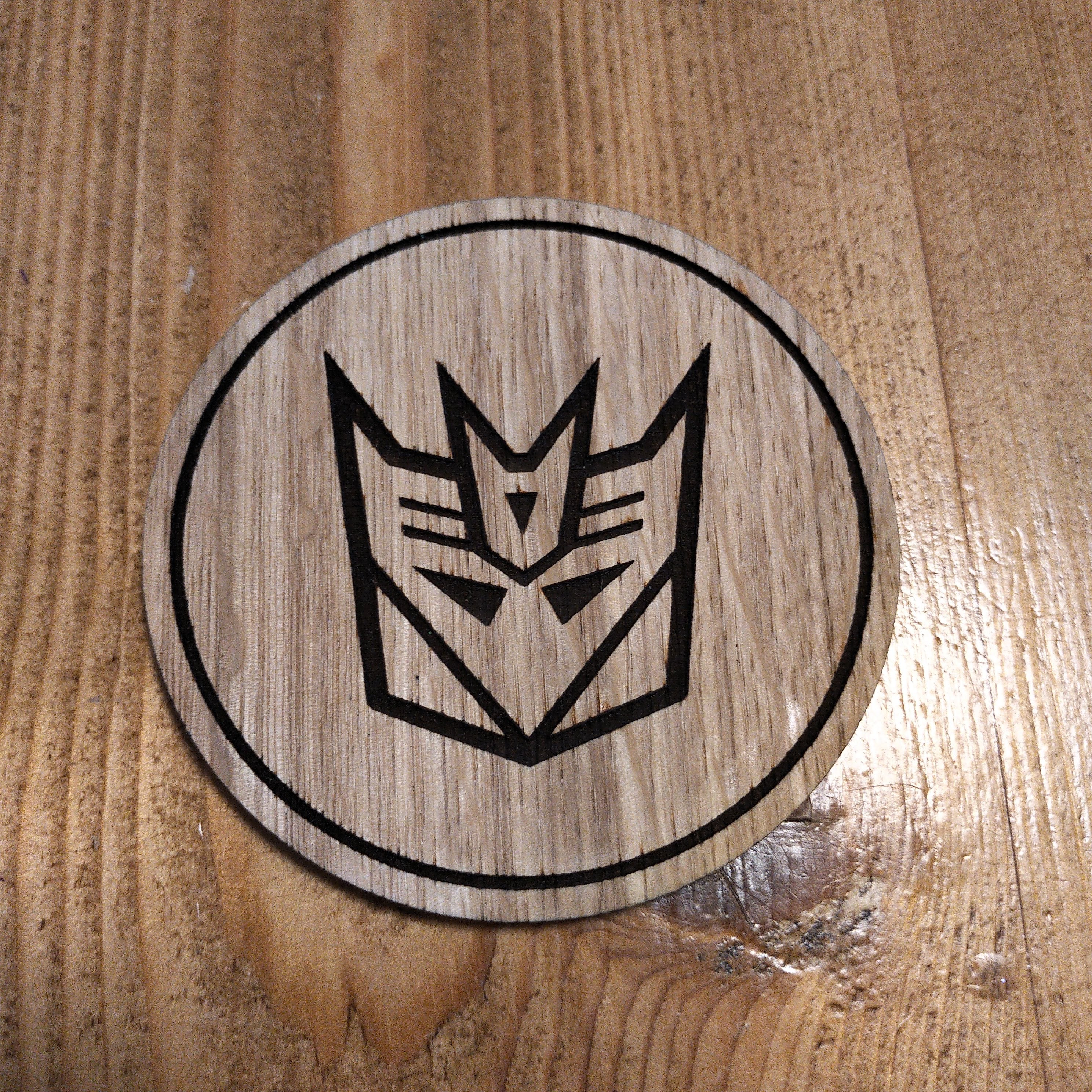 Laser cut wooden coaster. Deception 1980s cartoon