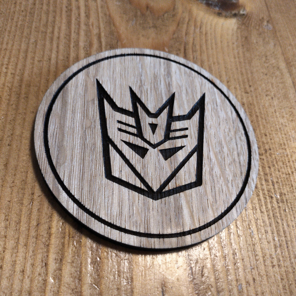 Laser cut wooden coaster. Deception 1980s cartoon