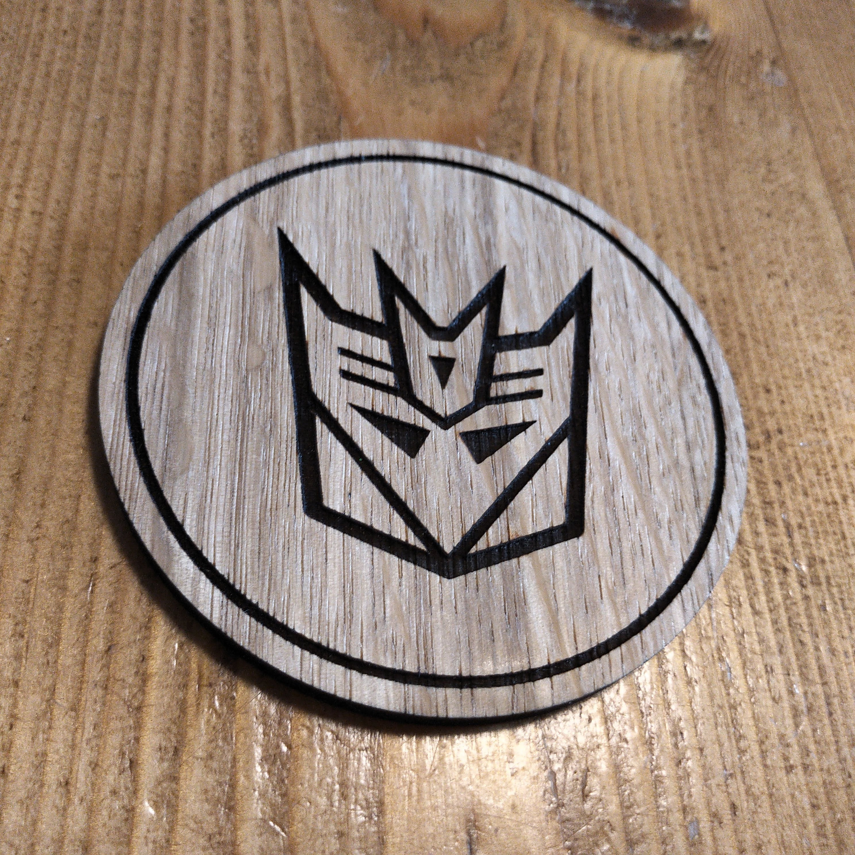 Laser cut wooden coaster. Deception 1980s cartoon
