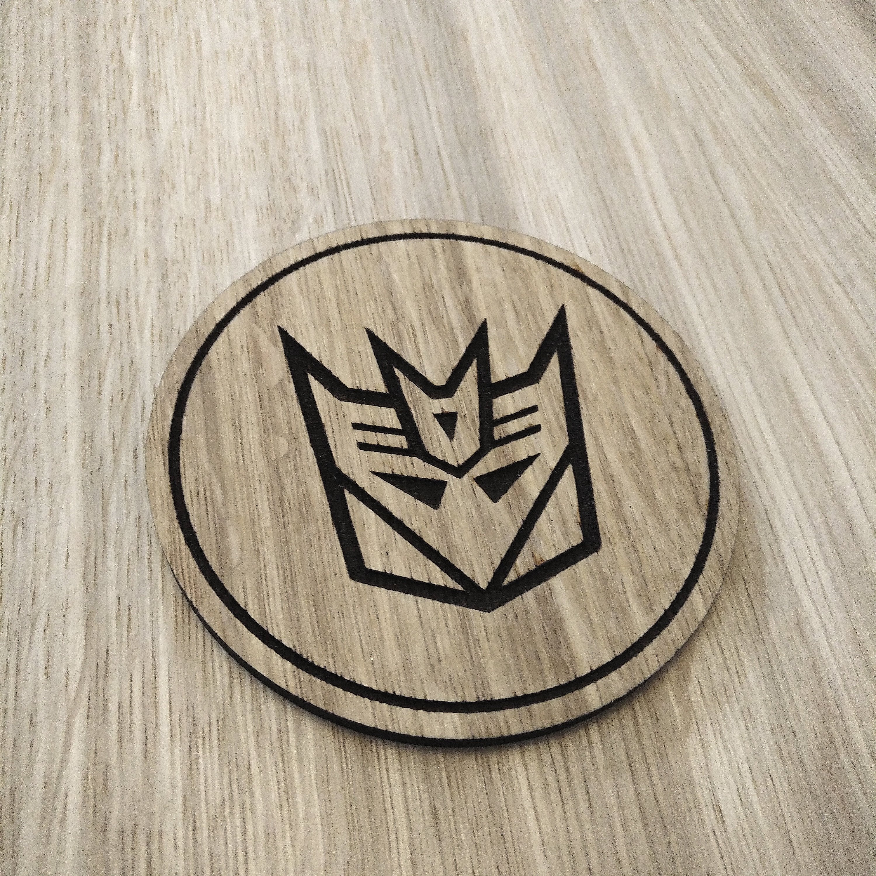 Laser cut wooden coaster. Deception 1980s cartoon