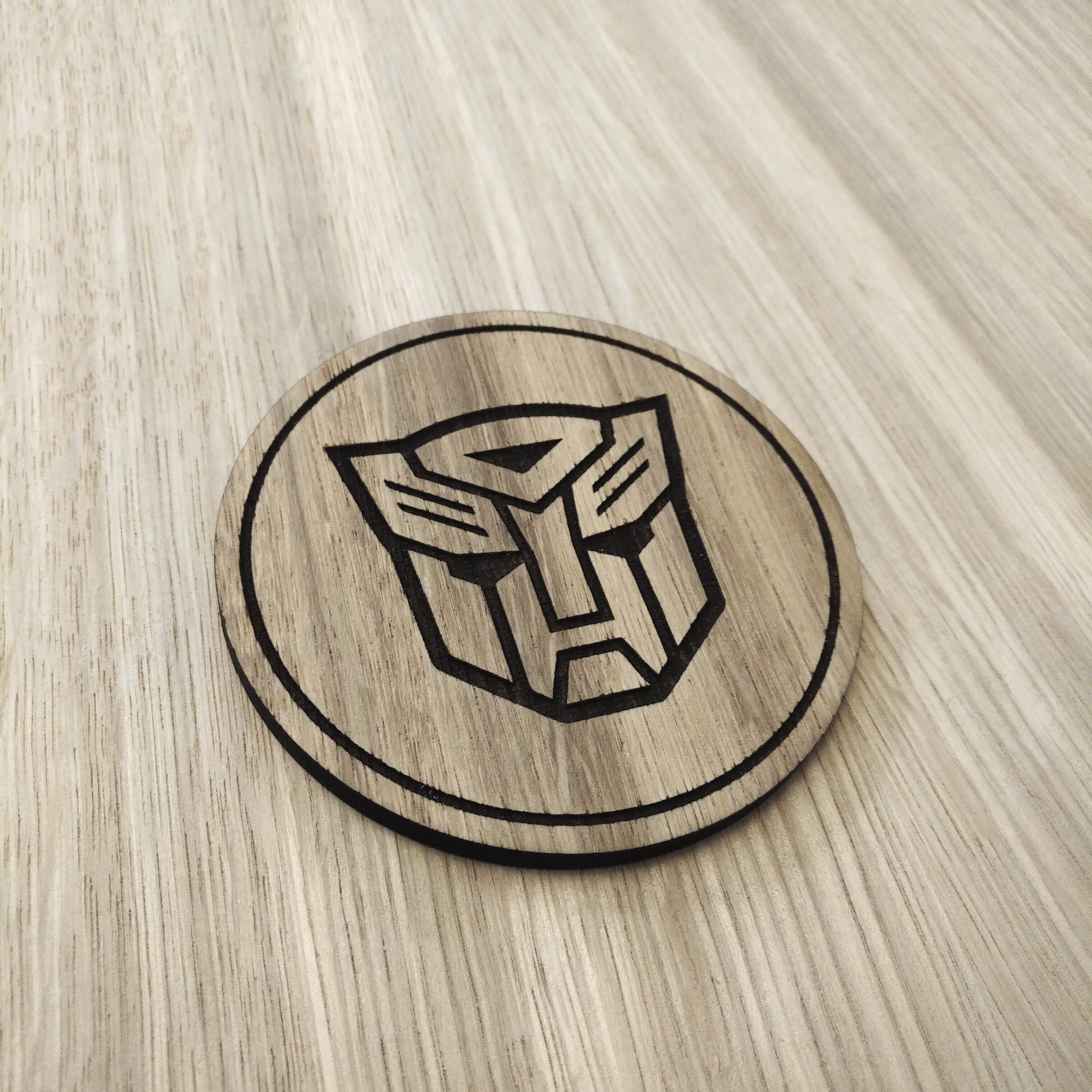 Laser cut wooden coaster. Autobot 1980s cartoon