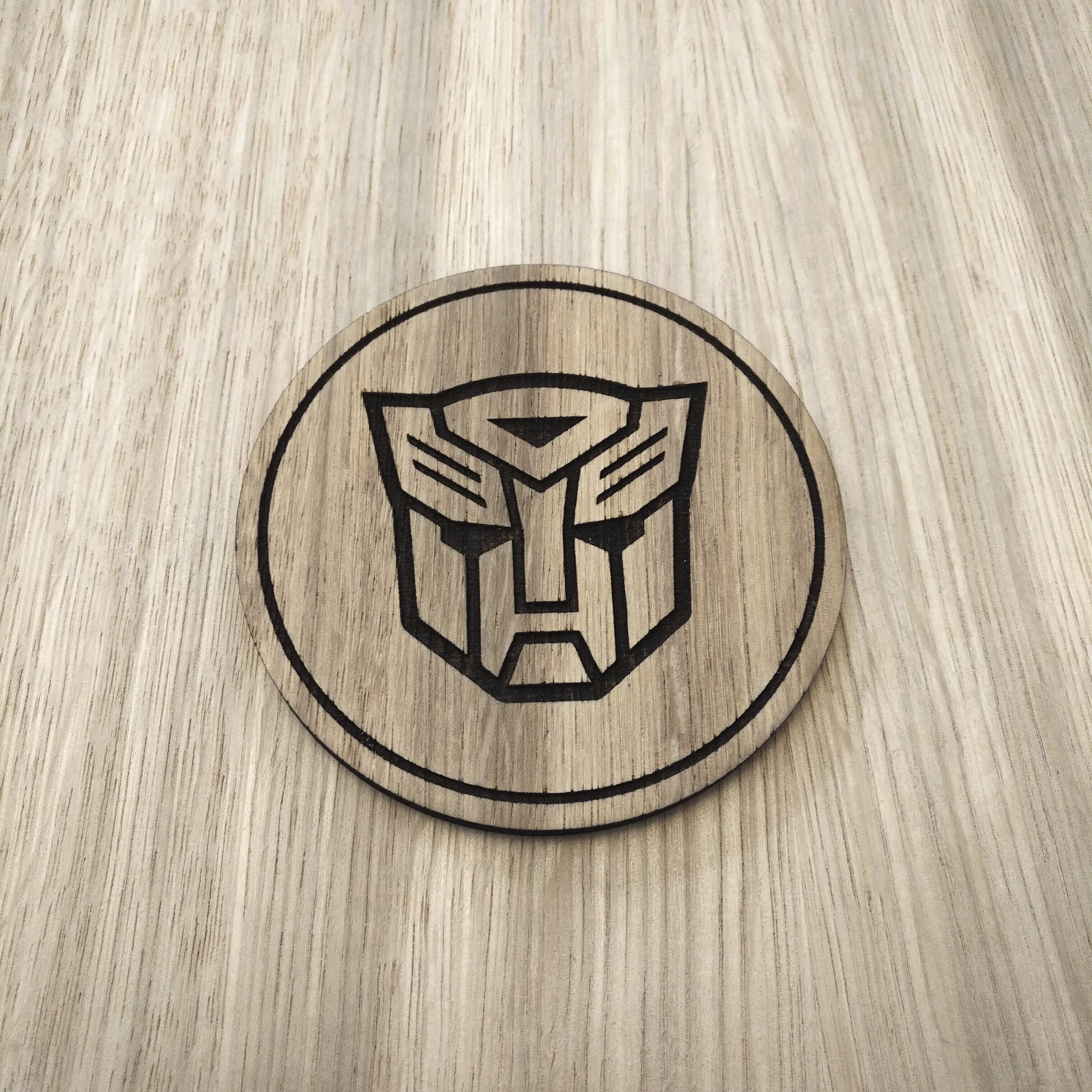 Laser cut wooden coaster. Autobot 1980s cartoon