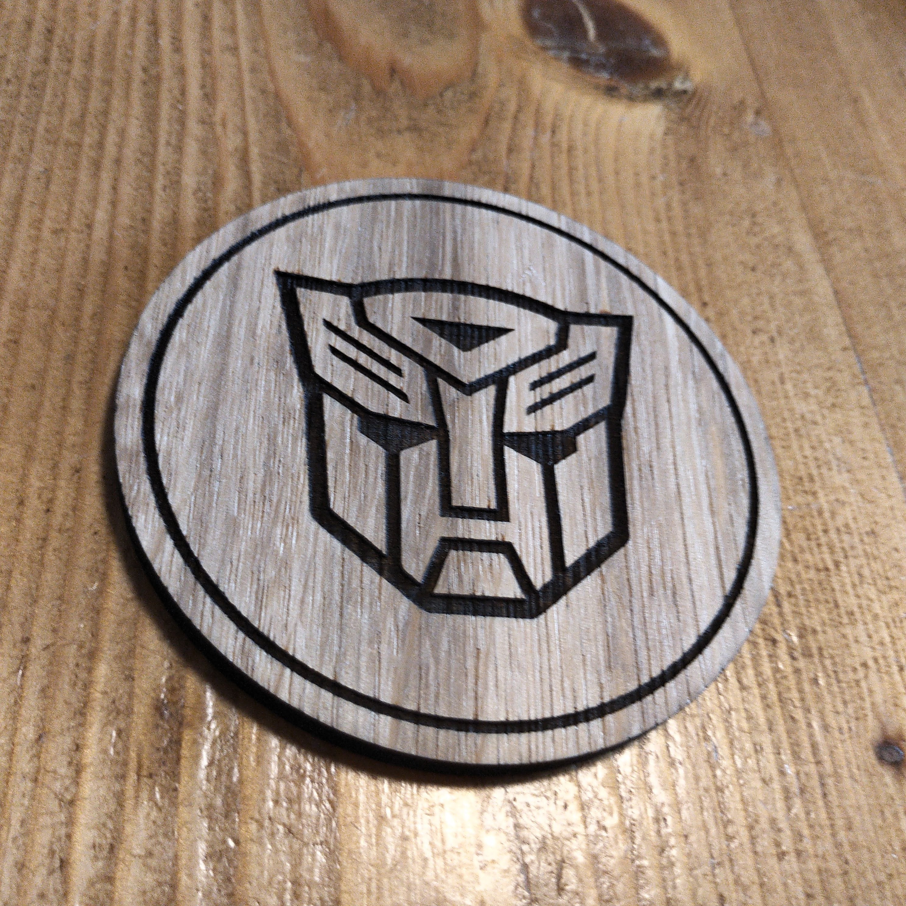 Laser cut wooden coaster. Autobot 1980s cartoon