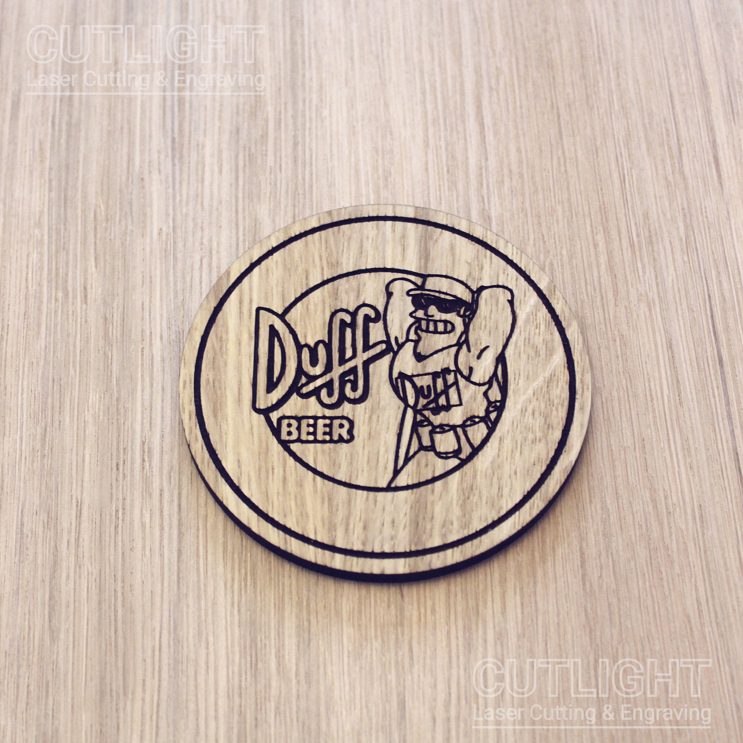 Laser cut wooden coaster. Simpsons Duff Beer cartoon