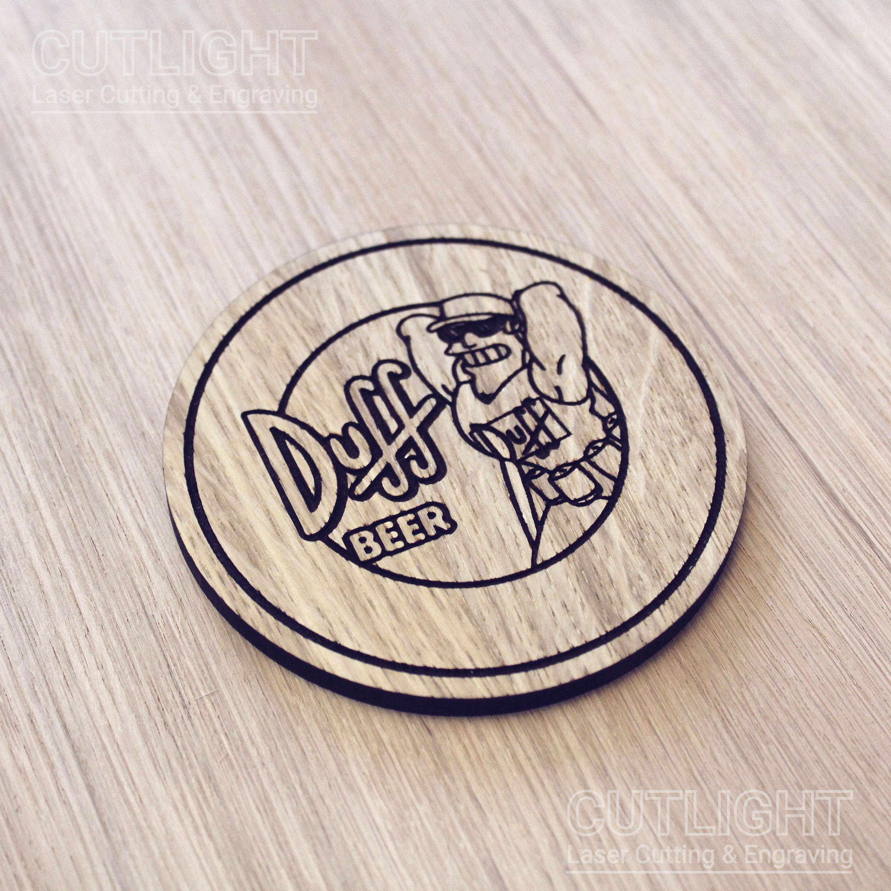 Laser cut wooden coaster. Simpsons Duff Beer cartoon