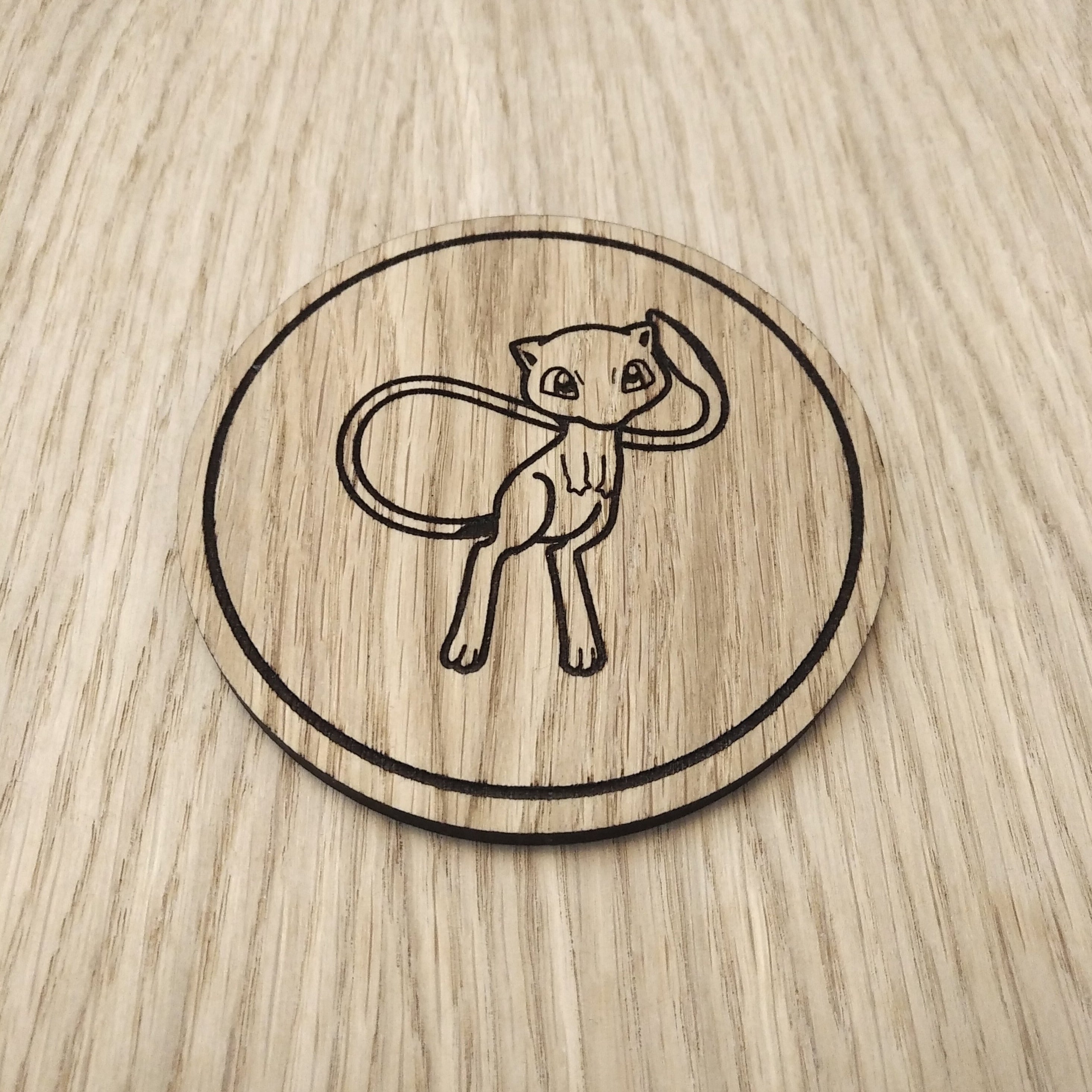 Laser cut wooden coaster. Mew