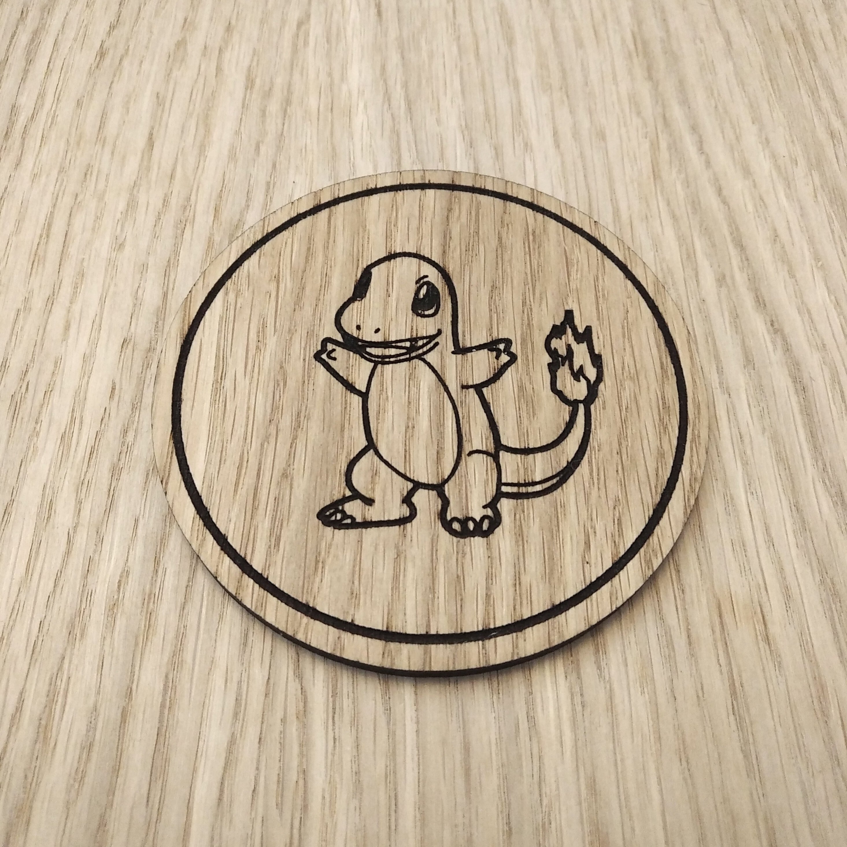 Laser cut wooden coaster. Charmander