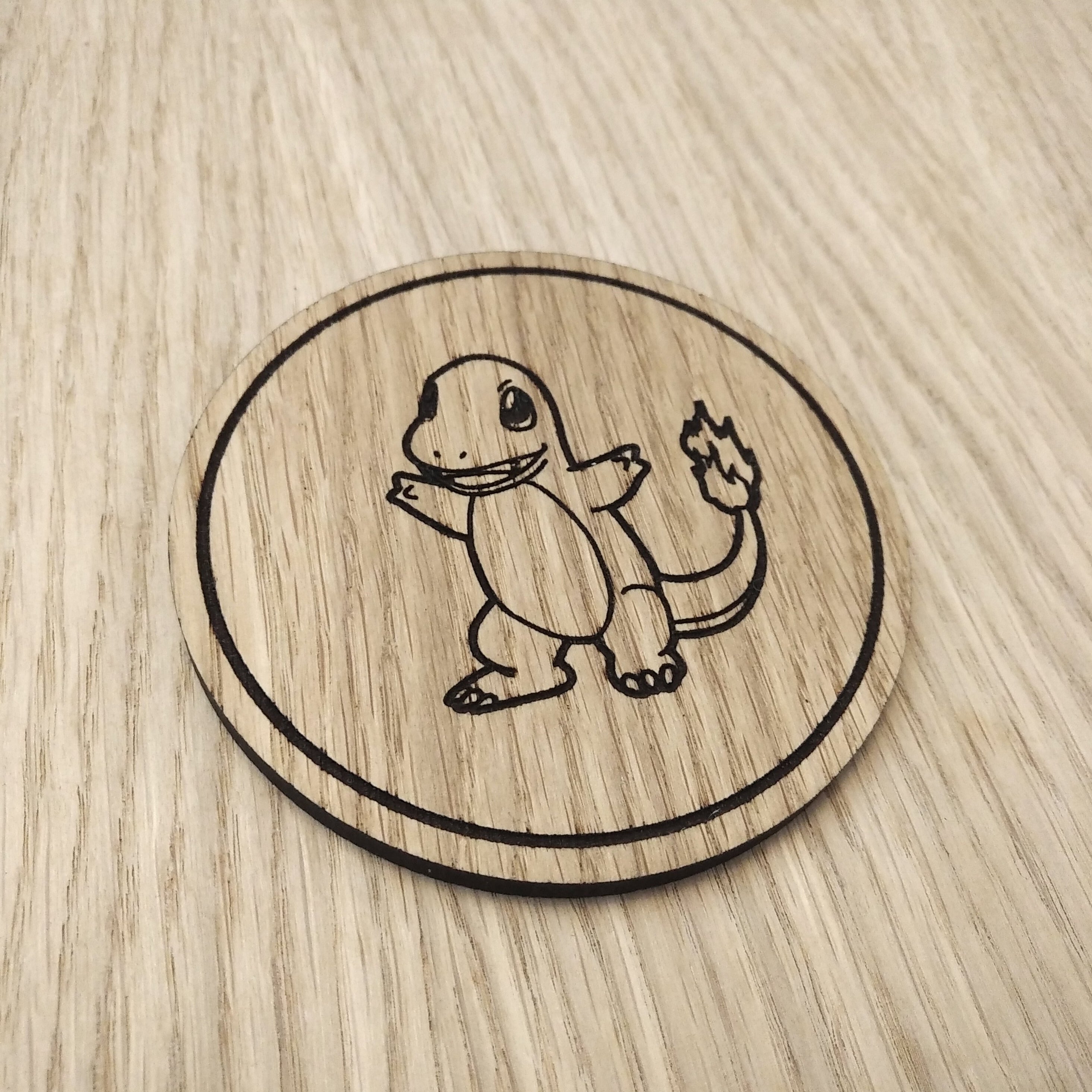 Laser cut wooden coaster. Charmander