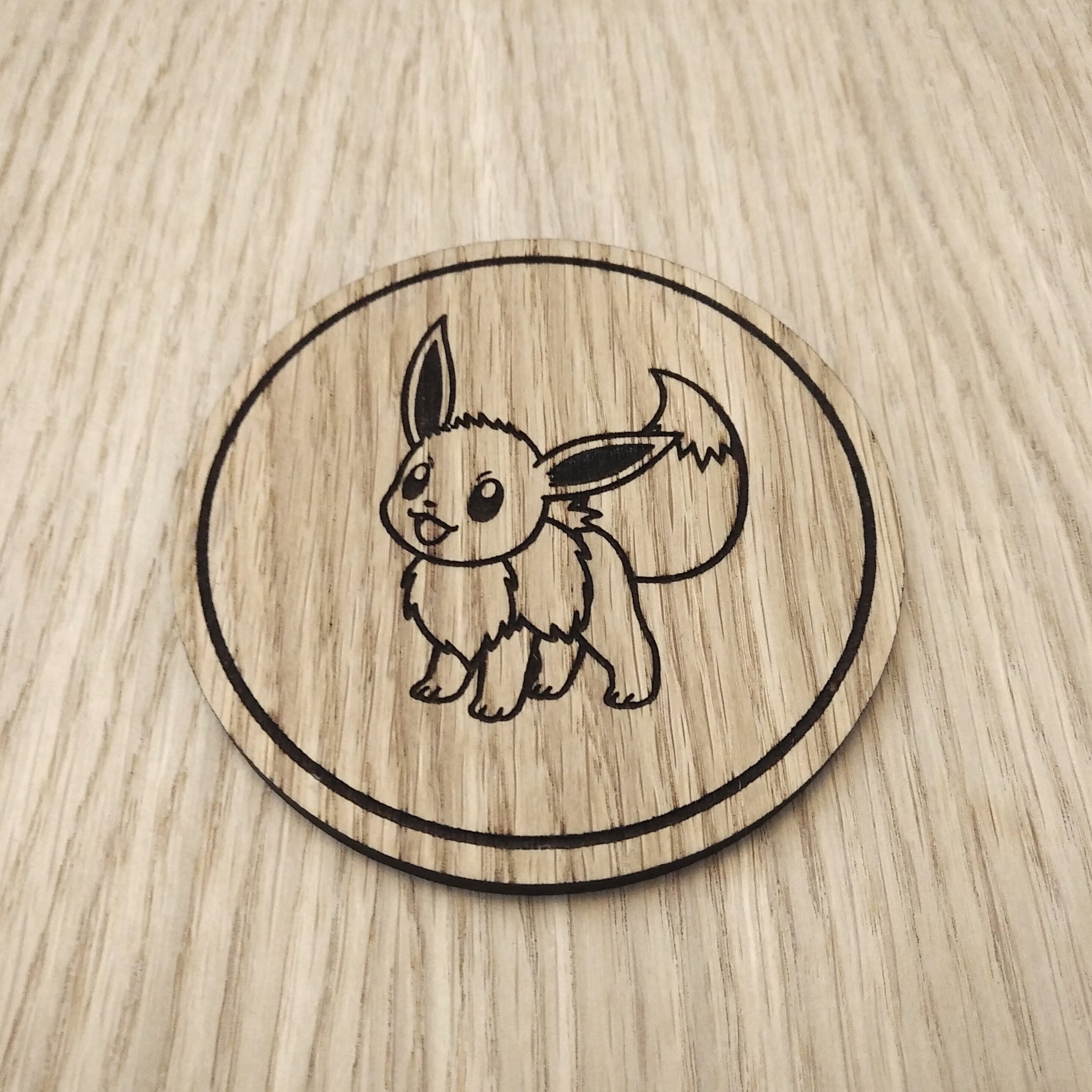 Laser cut wooden coaster. Eevee