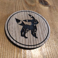 Laser cut wooden coaster. Eevee Obsidian