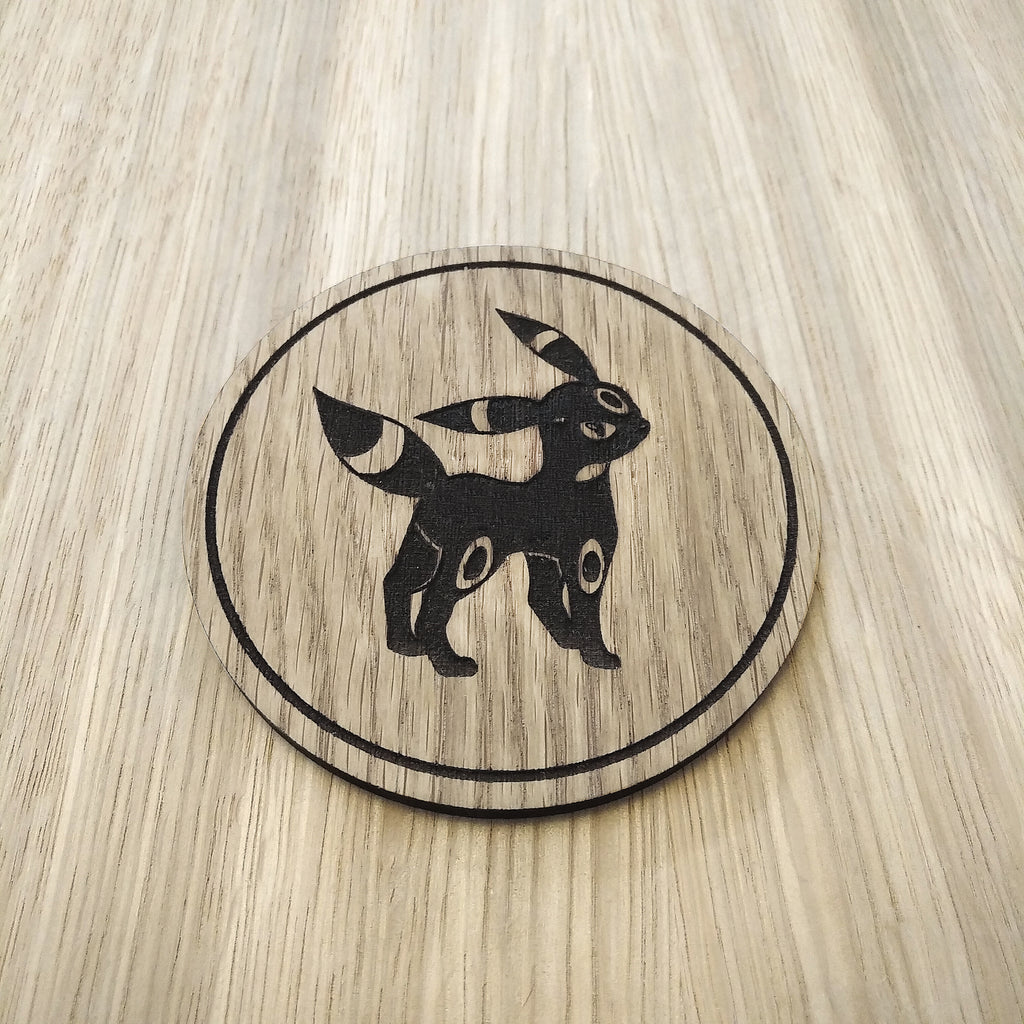 Laser cut wooden coaster. Eevee Obsidian