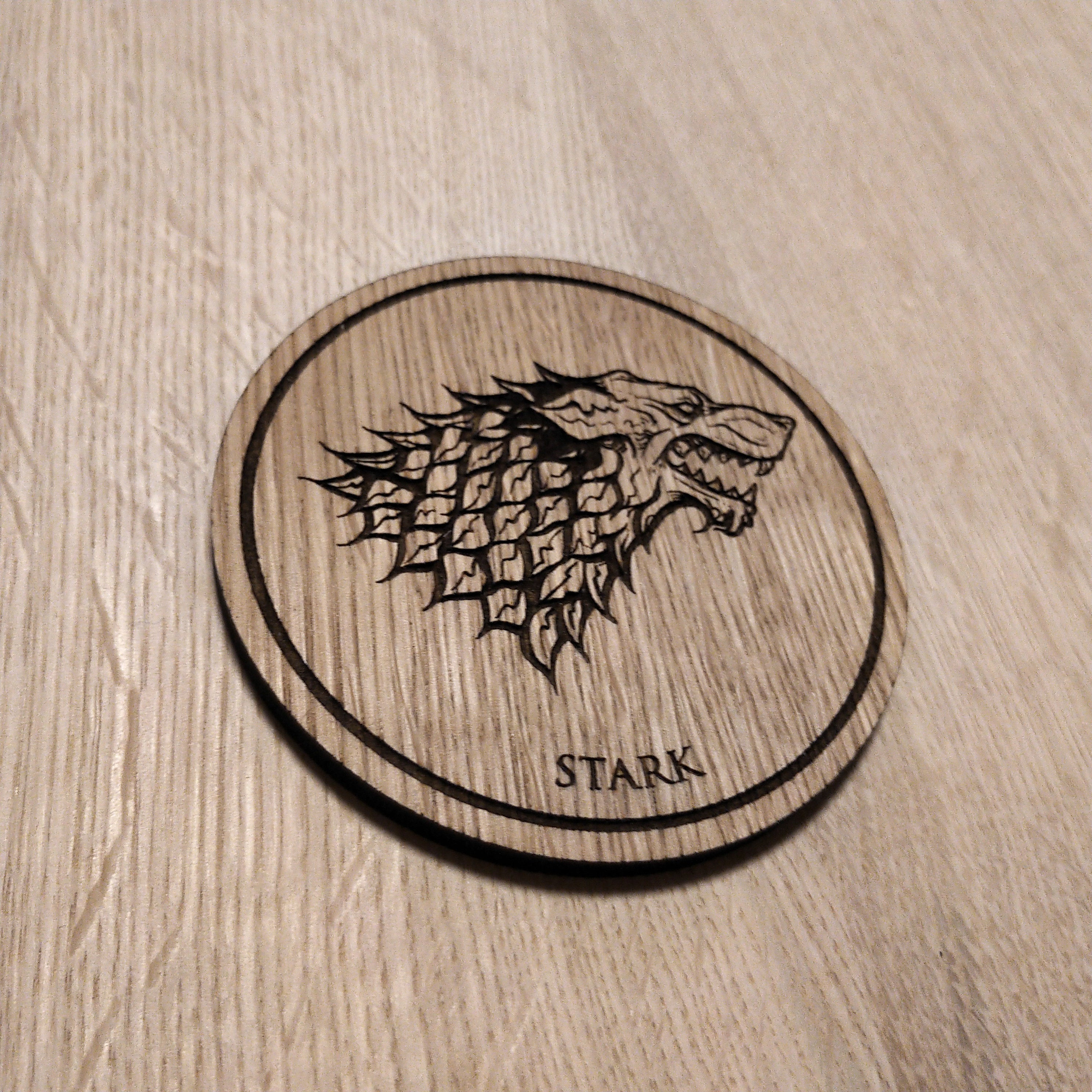 Laser cut wooden coaster. House Stark
