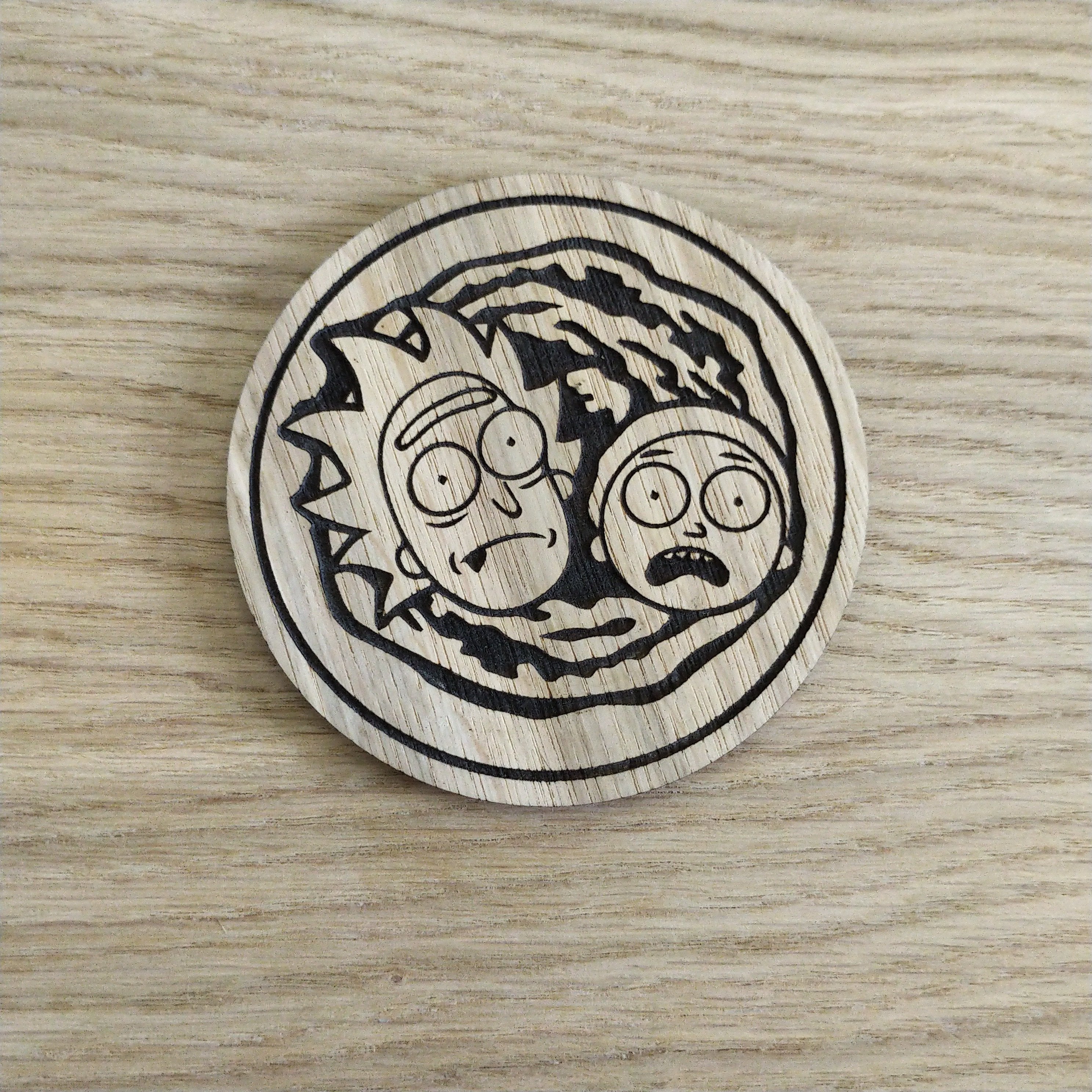 Laser cut wooden coaster. Rick