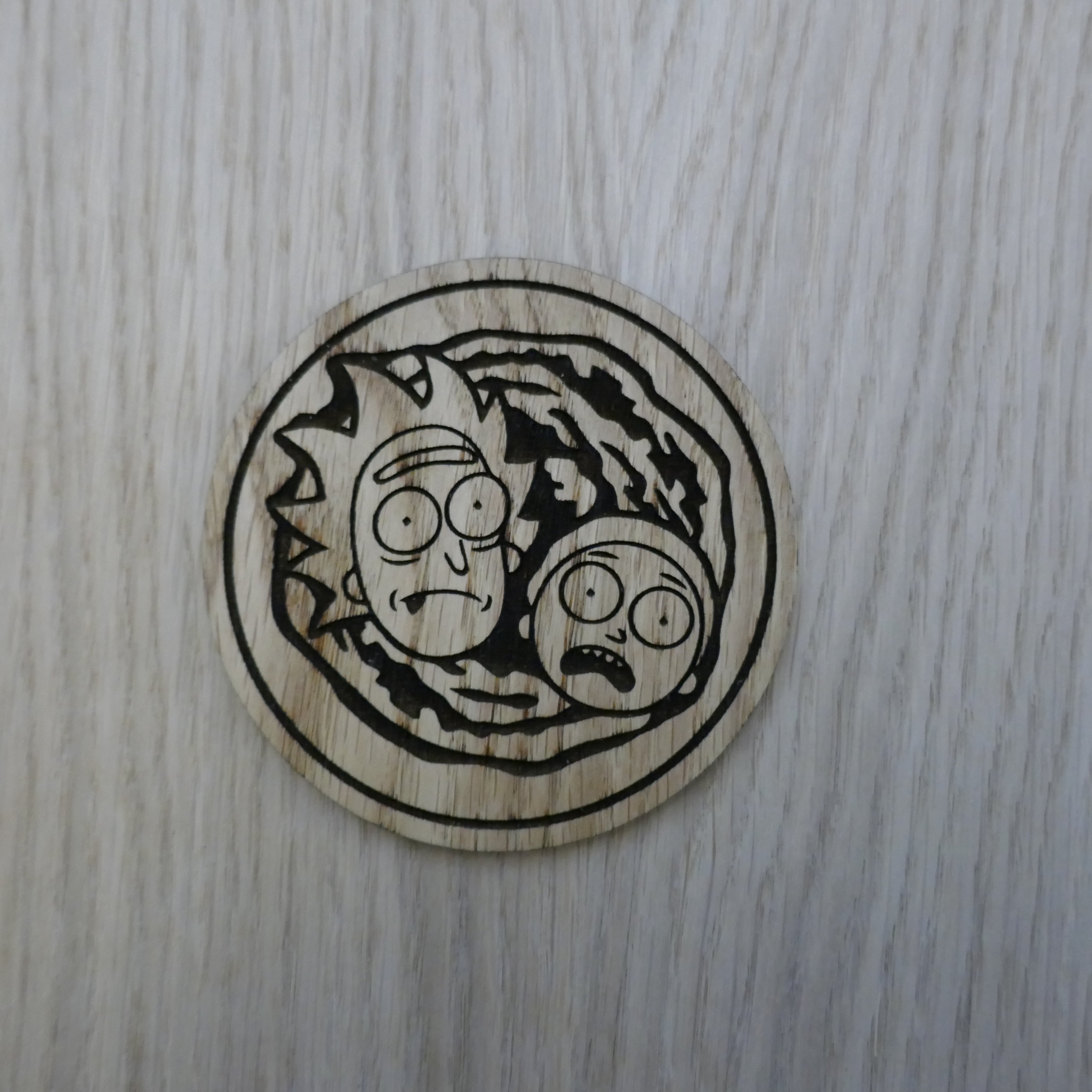 Laser cut wooden coaster. Rick