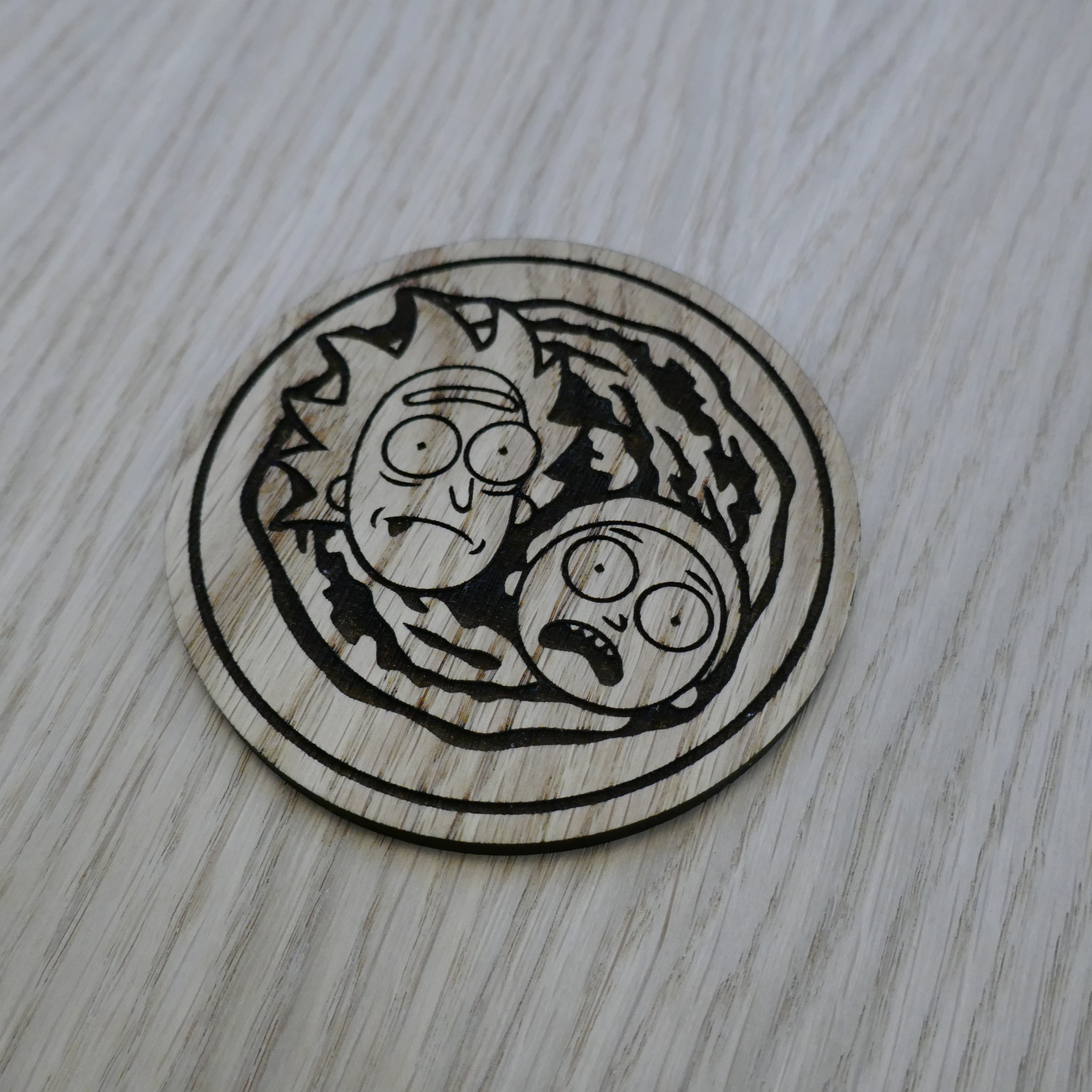 Laser cut wooden coaster. Rick