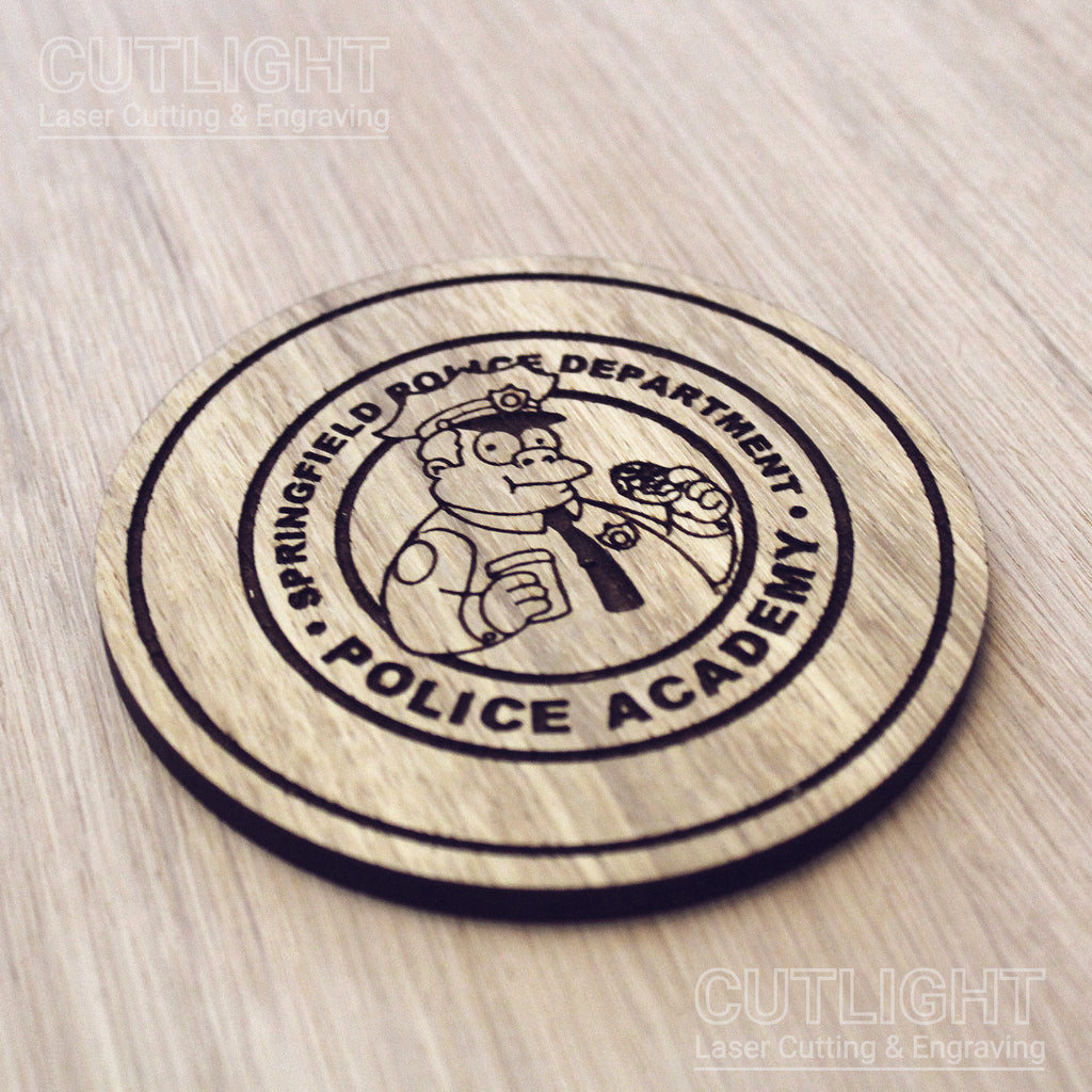 Laser cut wooden coaster personalised. Police Academy pun cartoon