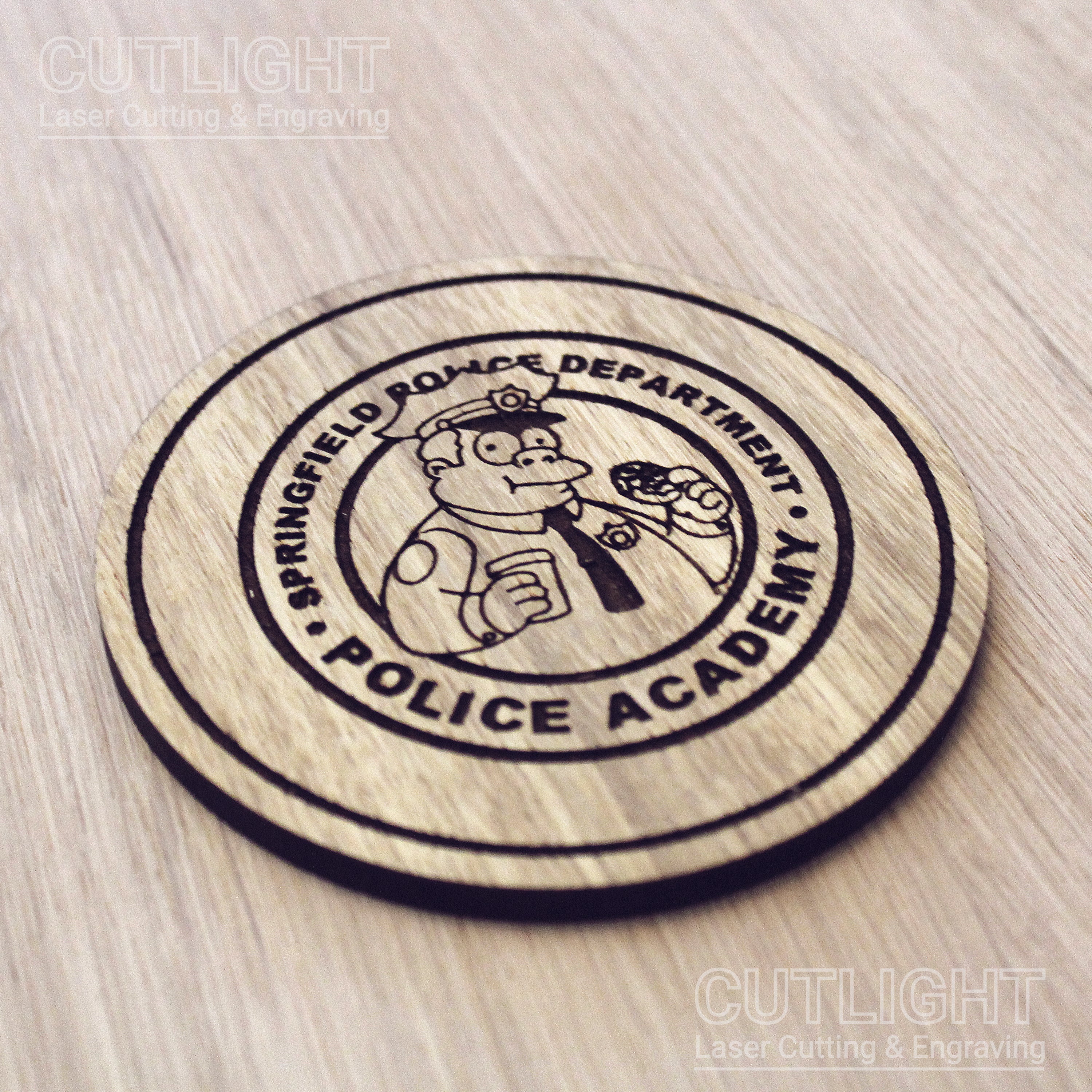 Laser cut wooden coaster personalised. Police Academy pun cartoon