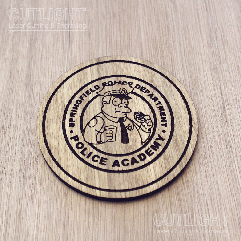 Laser cut wooden coaster personalised. Police Academy pun cartoon