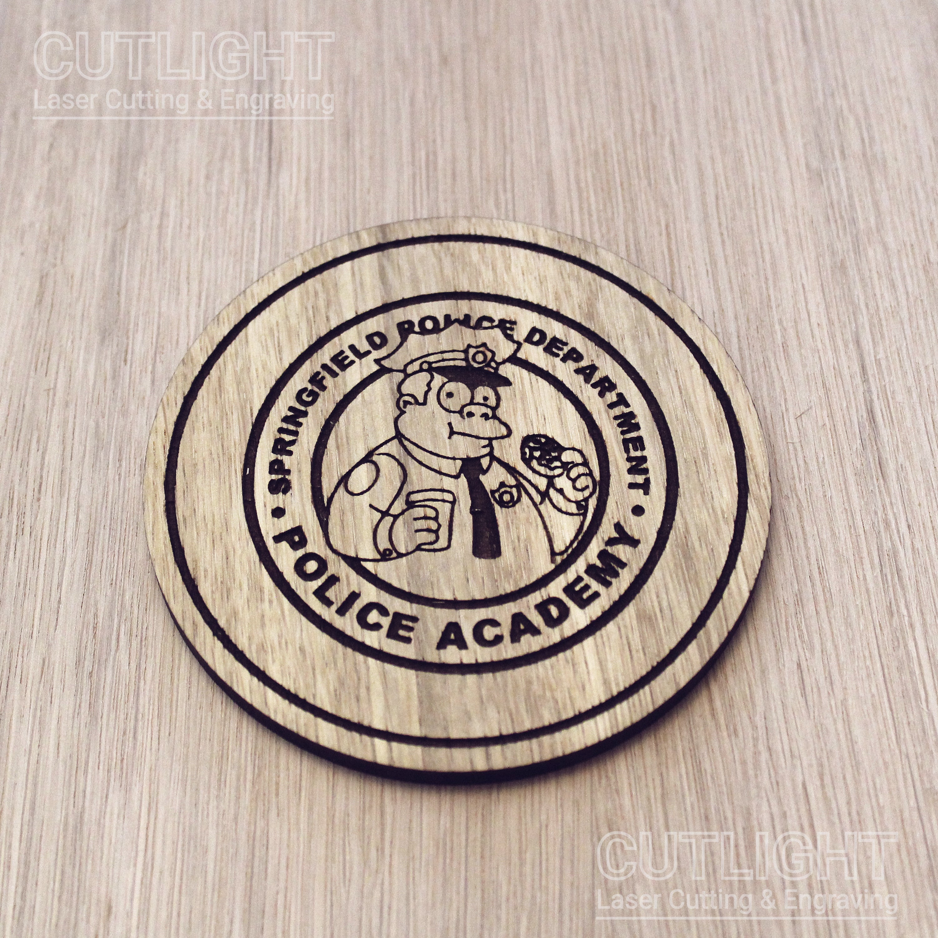 Laser cut wooden coaster personalised. Police Academy pun cartoon