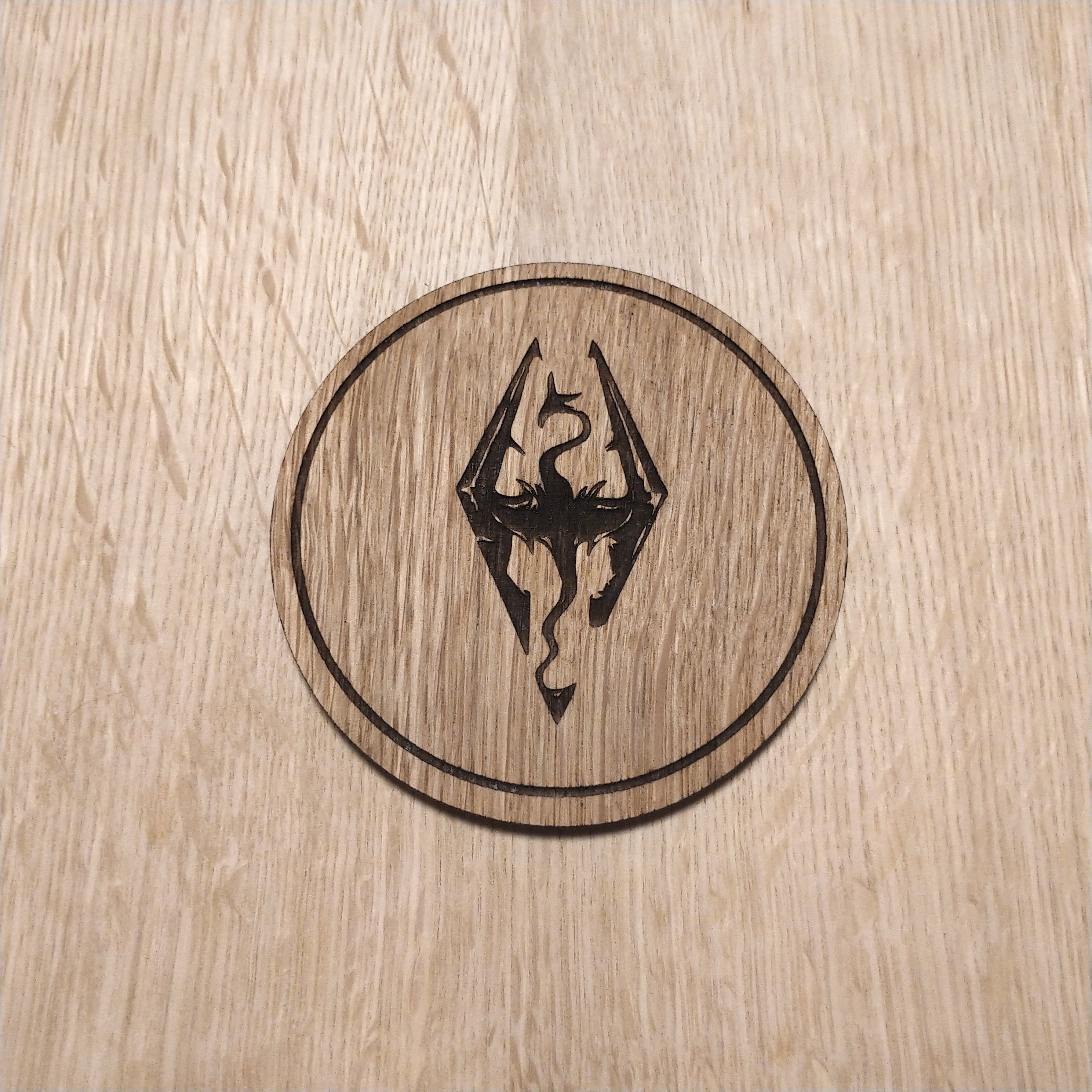 Laser cut wooden coaster. Dragon born Design
