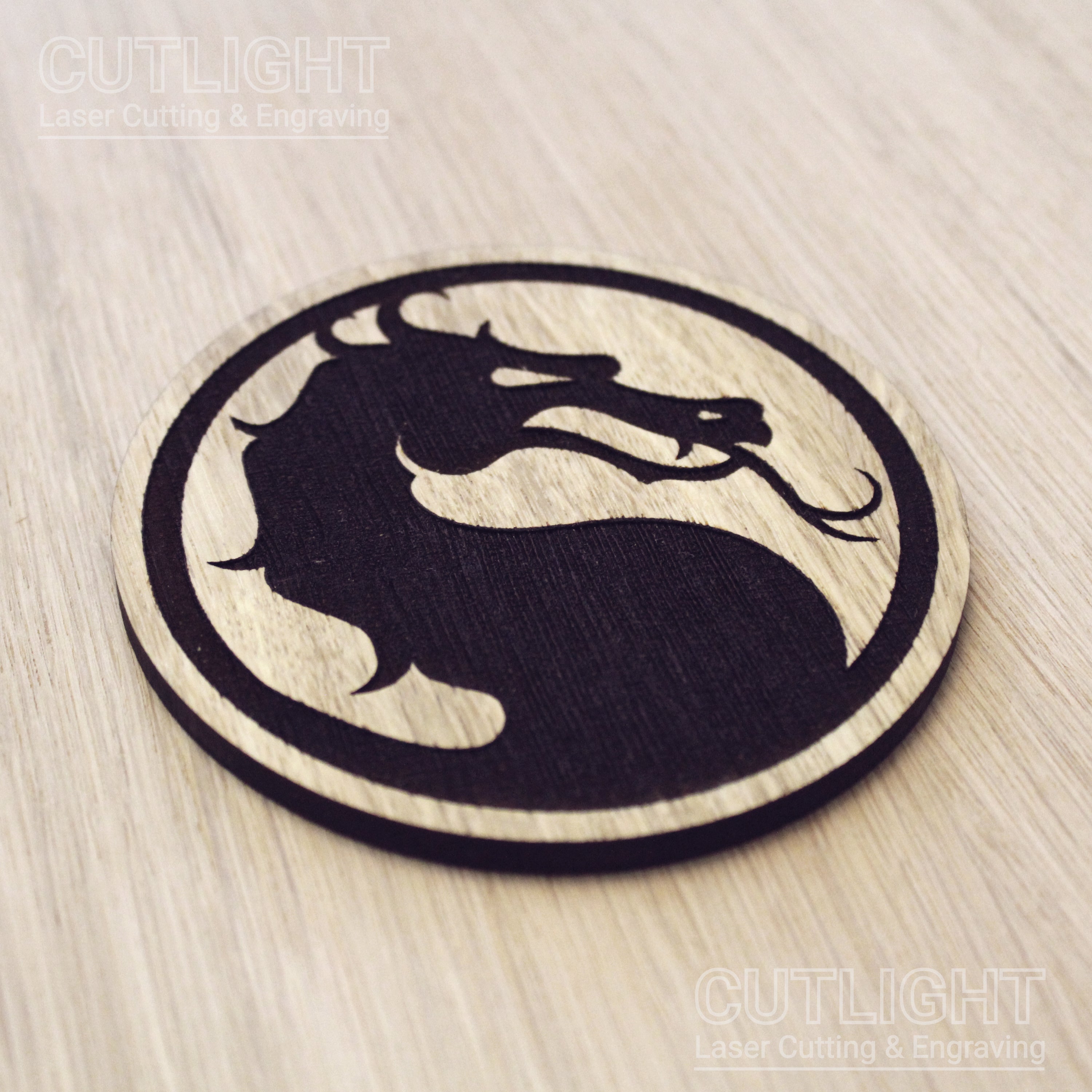 Laser cut wooden coaster. Kombat dragon