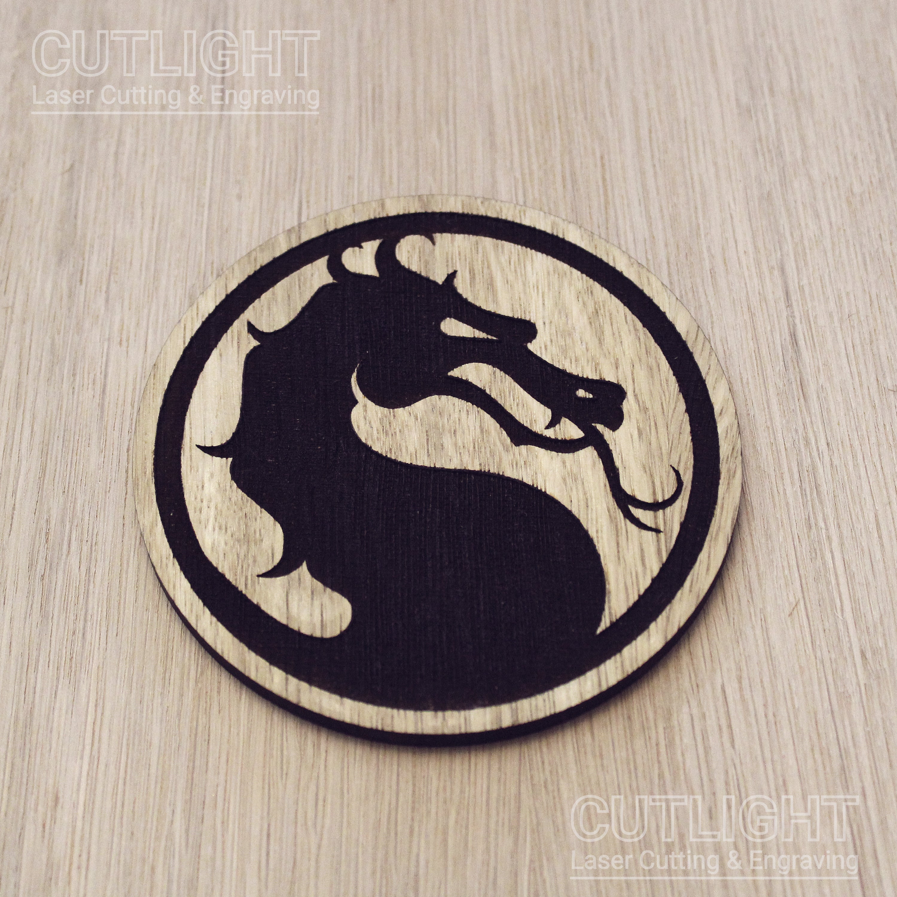 Laser cut wooden coaster. Kombat dragon