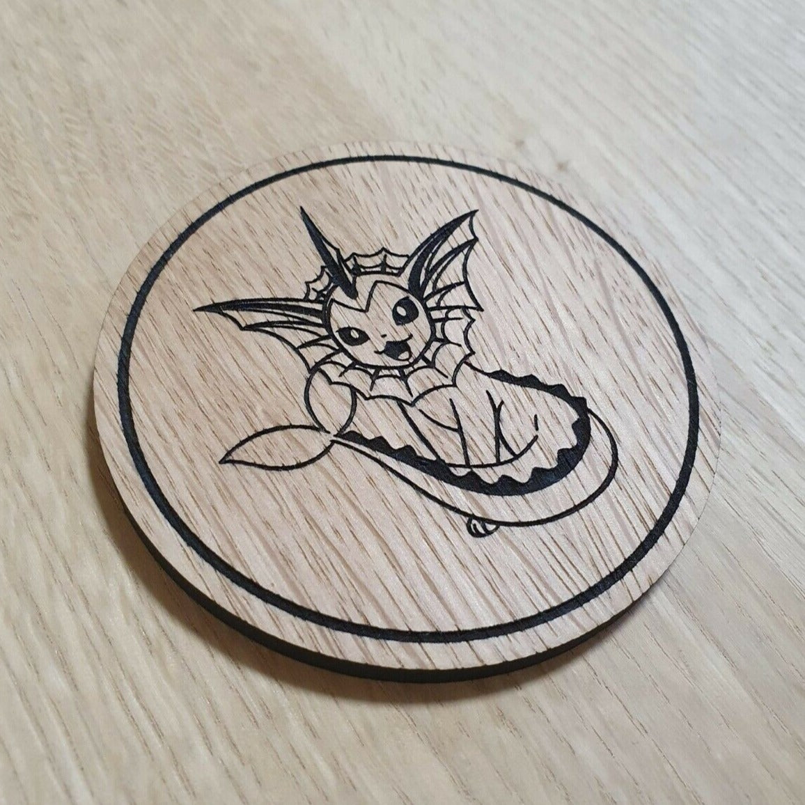 Laser cut wooden coaster. Vaporeon