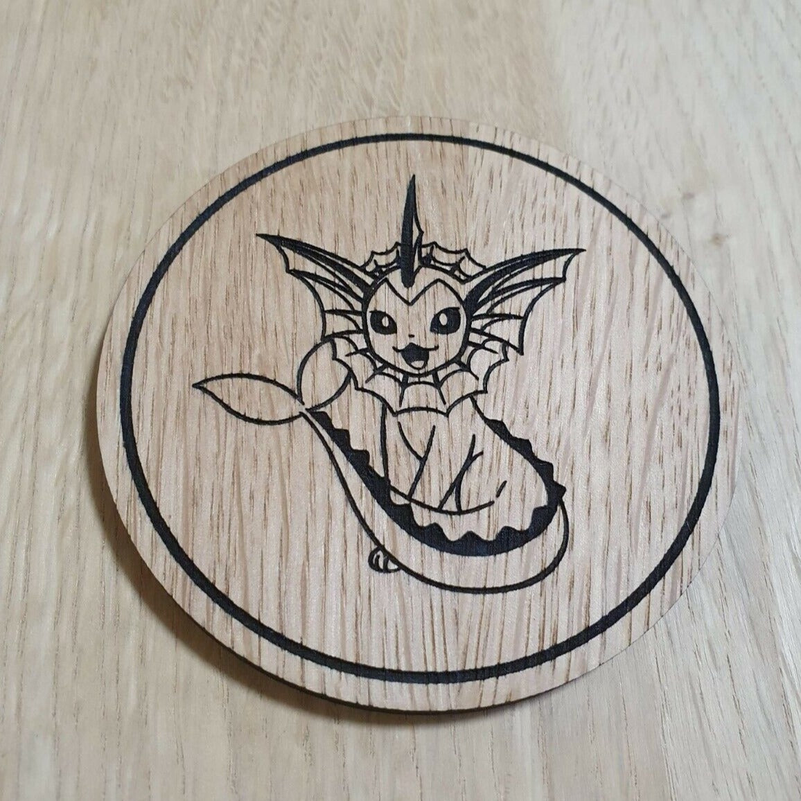 Laser cut wooden coaster. Vaporeon