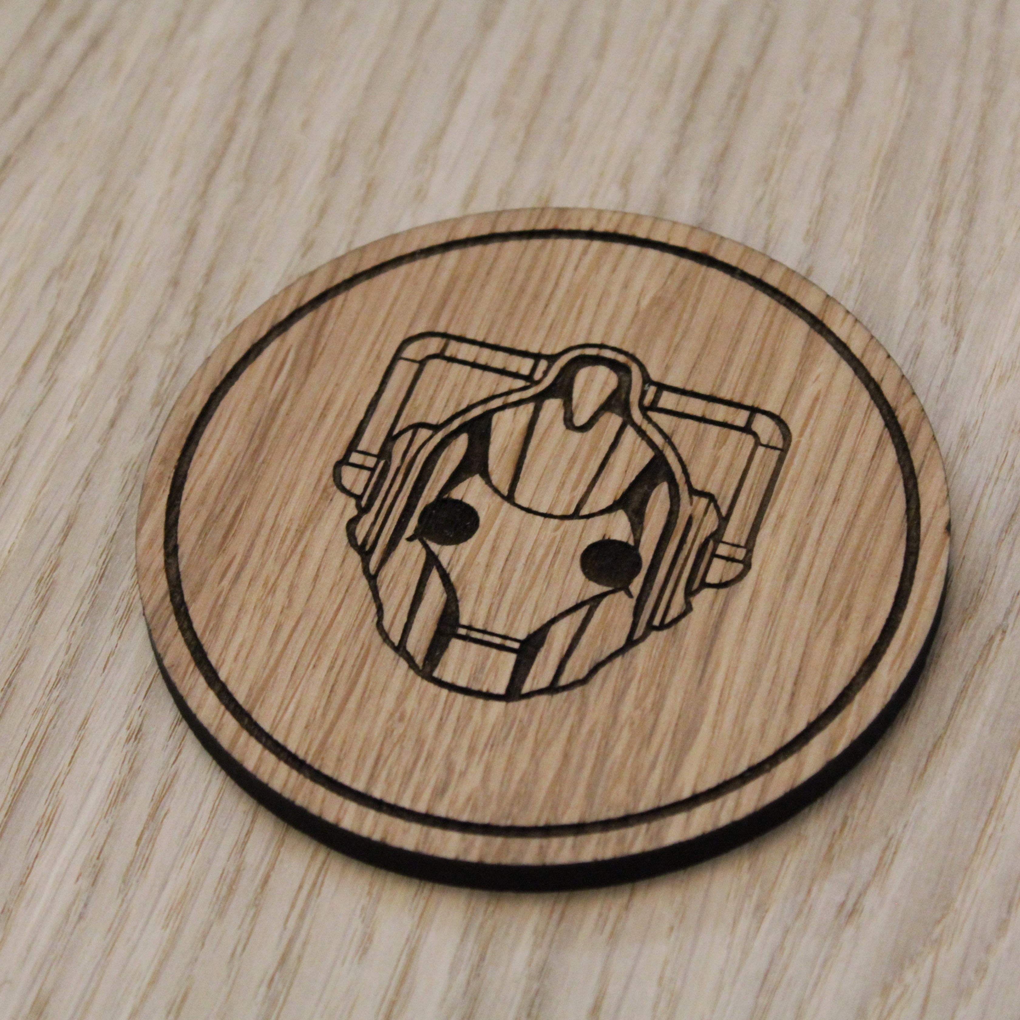 Laser cut wooden coaster. Cyberman