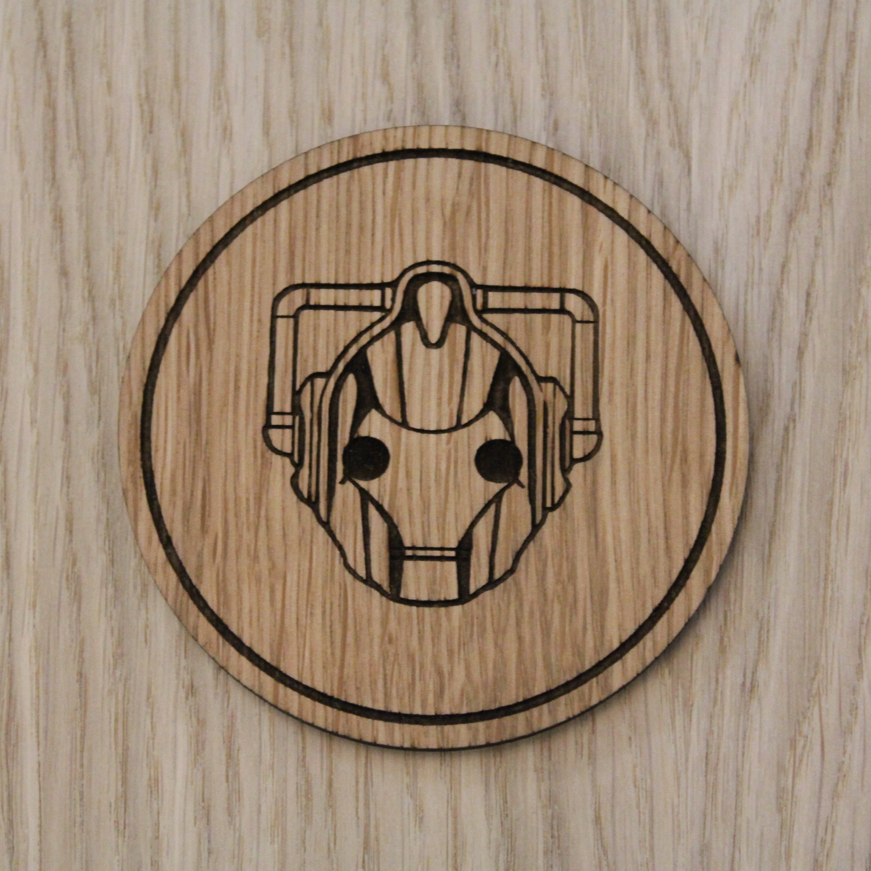 Laser cut wooden coaster. Cyberman