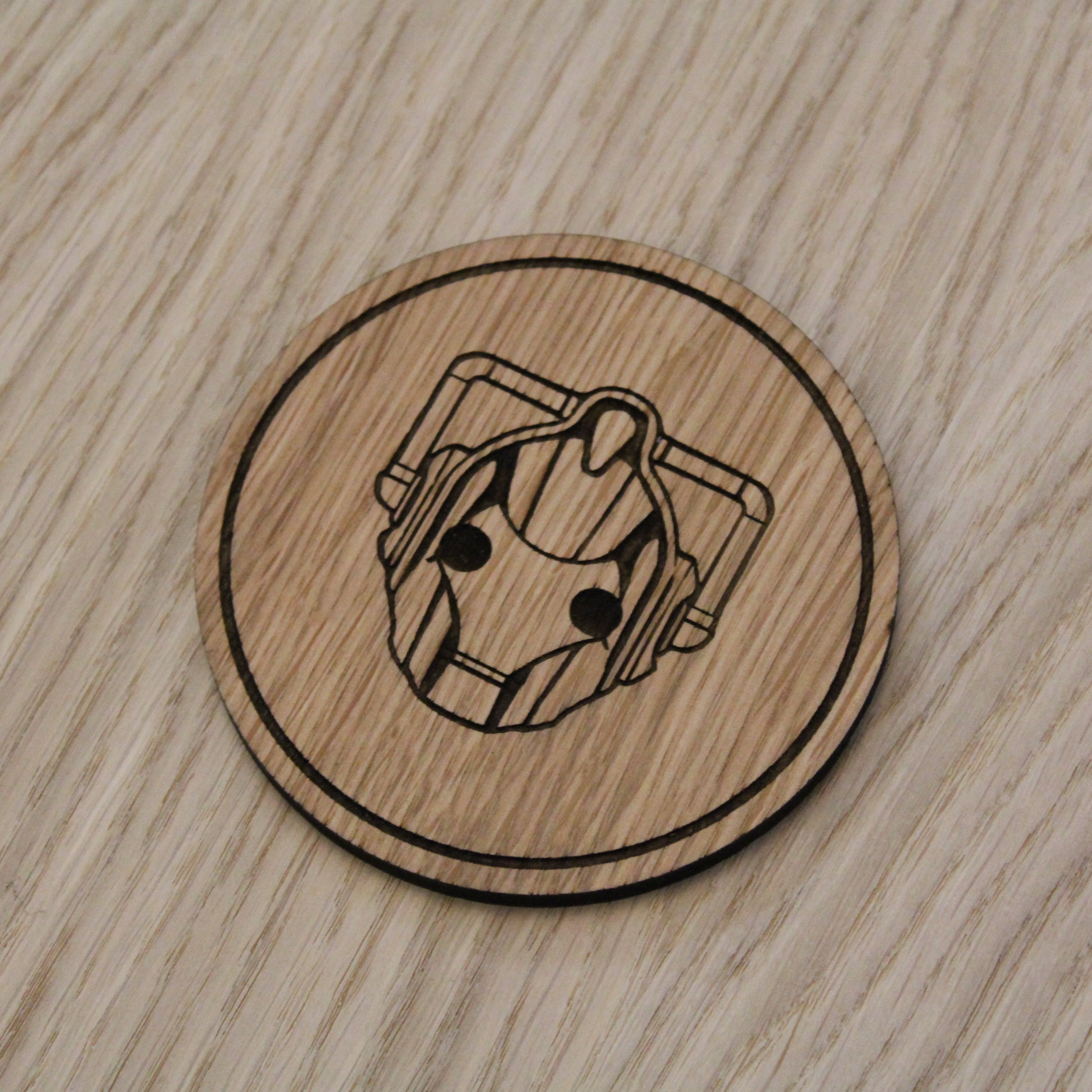 Laser cut wooden coaster. Cyberman